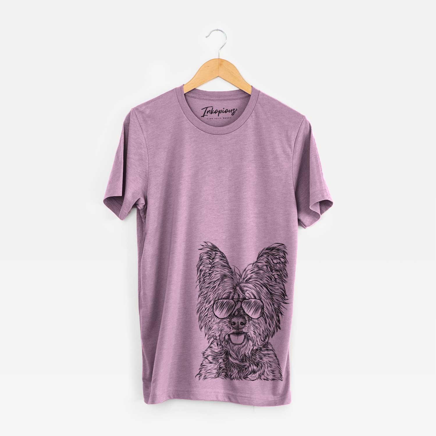 Hand-drawn sketch of McDuff the Cairn Terrier wearing aviator sunglasses on an Orchid Bella Canvas Unisex Crewneck