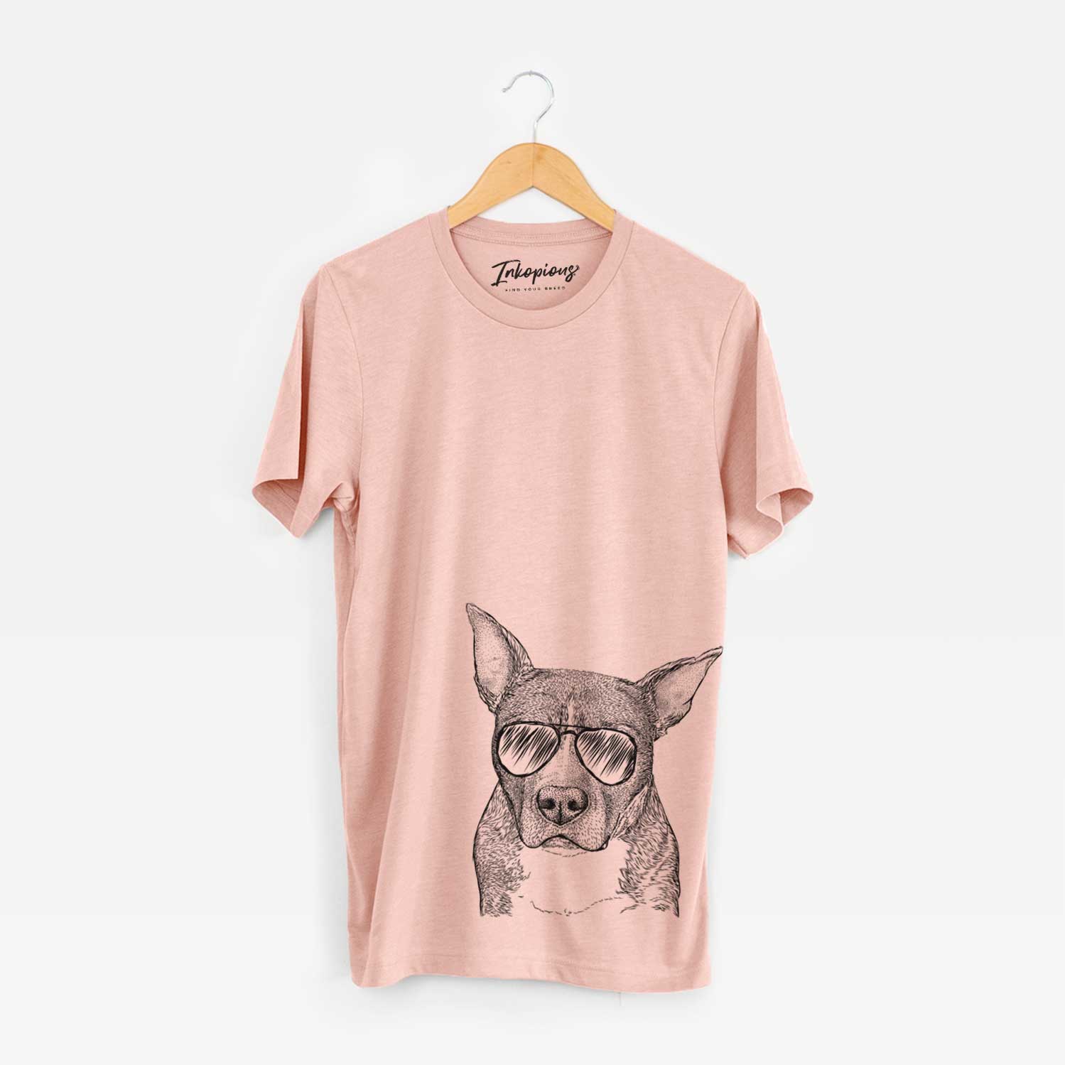 Hand-drawn sketch of Mercy the Pitbull wearing aviator sunglasses on a Peach Unisex crewneck
