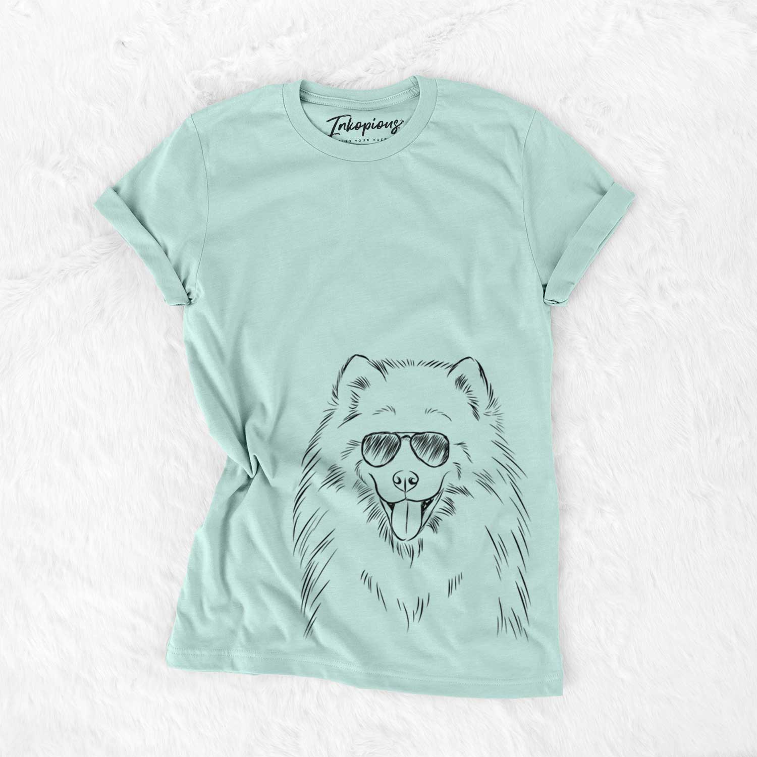 Hand-drawn sketch of Mikko the Samoyed wearing aviator sunglasses on a Heather Sage Unisex crewneck