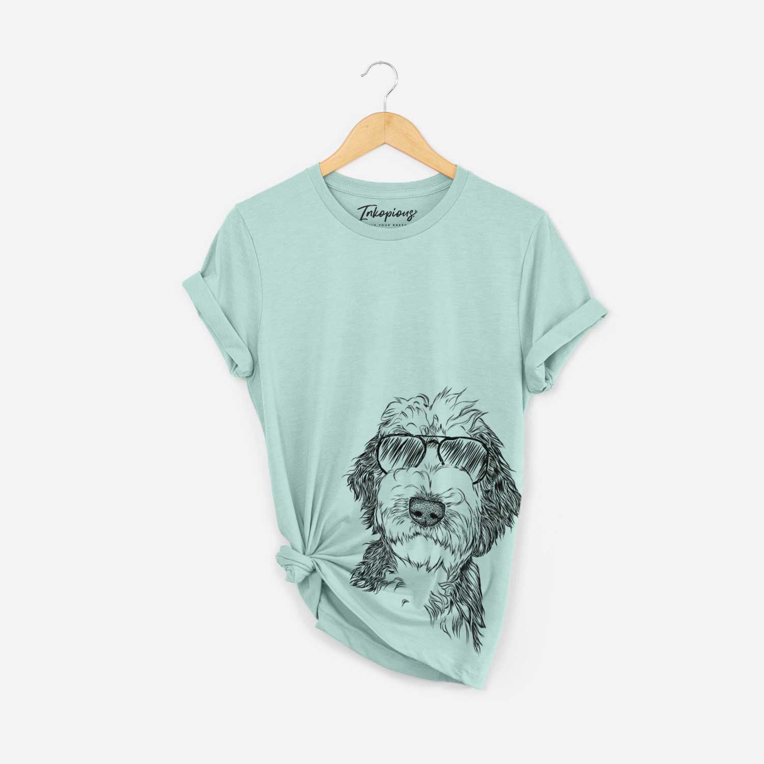 Hand-drawn sketch of Milo Fluff the Sheepadoodle wearing aviator sunglasses on a Heather Sage Bella Canvas Unisex Crewneck