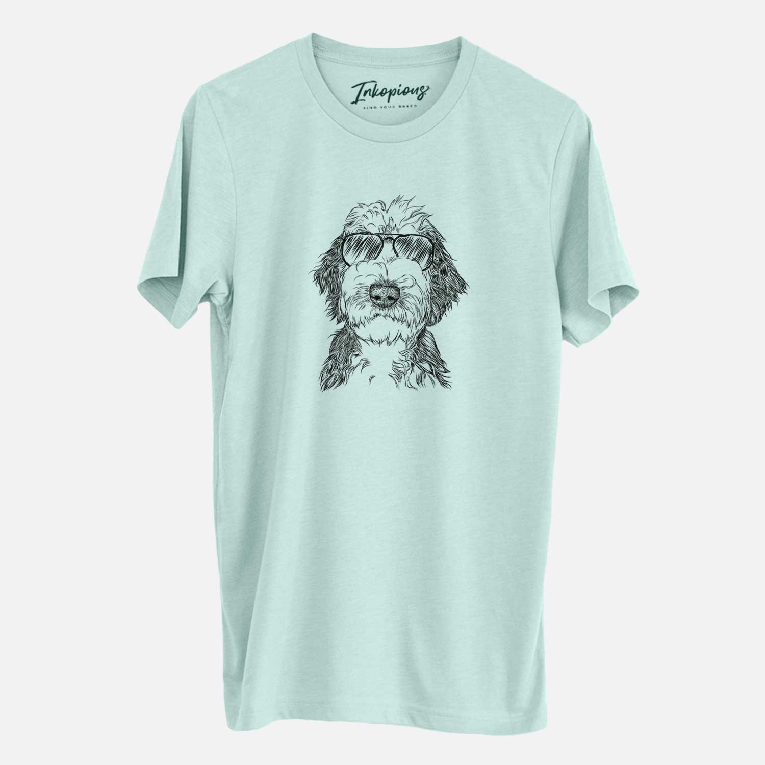 Hand-drawn sketch of Milo Fluff the Sheepadoodle wearing aviator sunglasses on a Heather Sage Unisex crewneck