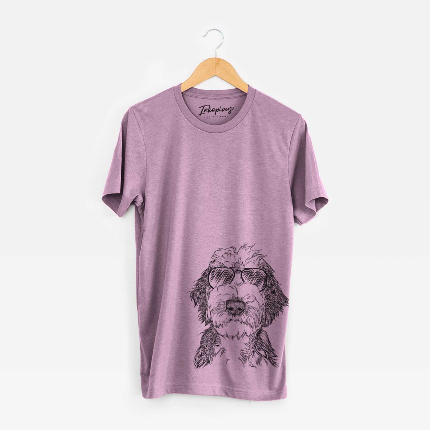 Hand-drawn sketch of Milo Fluff the Sheepadoodle wearing aviator sunglasses on an Orchid Unisex crewneck