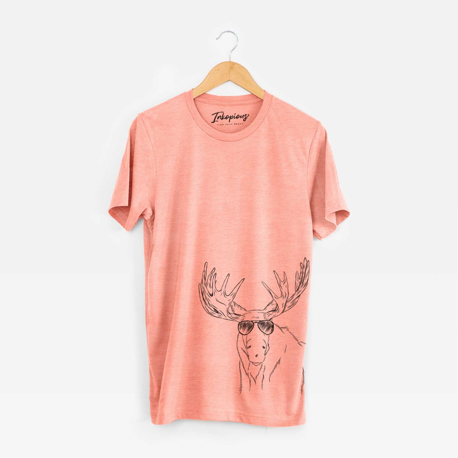 Hand-drawn sketch of Monty the Moose wearing aviator sunglasses on a Sunset Unisex crewneck