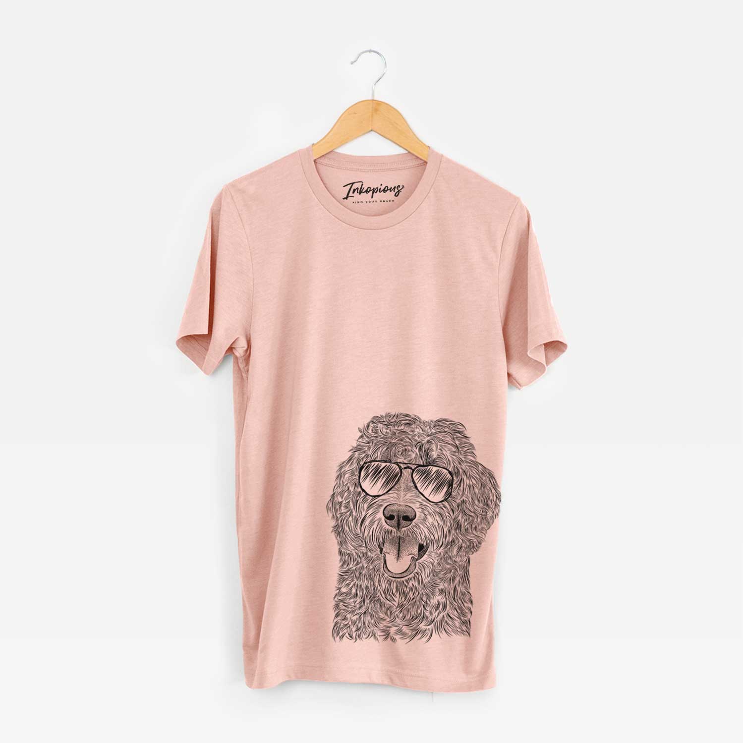 Hand-drawn sketch of Murr Dog the Labradoodle wearing aviator sunglasses on a Peach Unisex crewneck