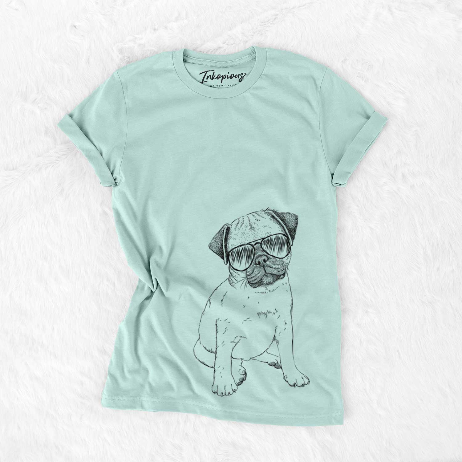 Hand-drawn sketch of Nelson the Pug Puppy wearing aviator sunglasses on a Heather Sage Unisex crewneck