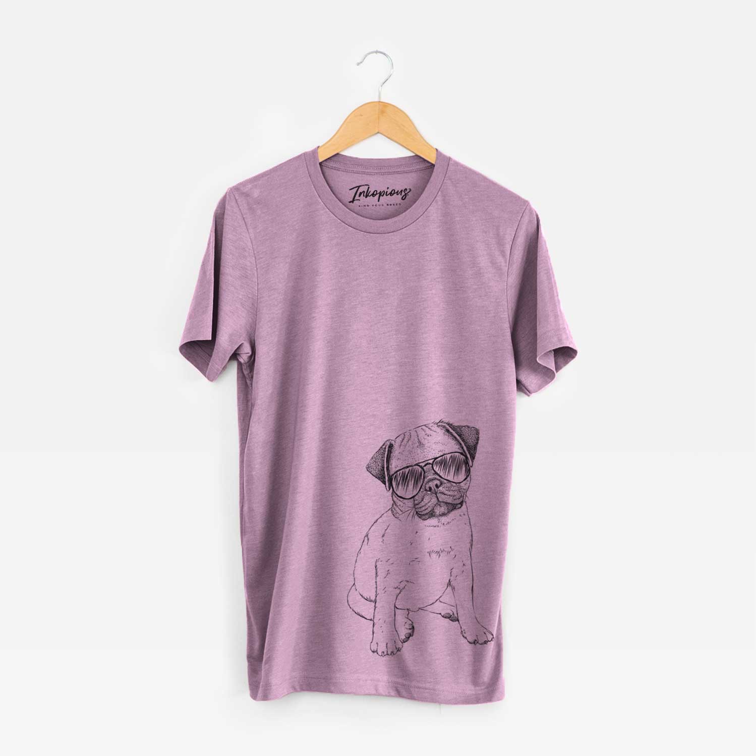 Hand-drawn sketch of Nelson the Pug Puppy wearing aviator sunglasses on an Orchid Unisex crewneck