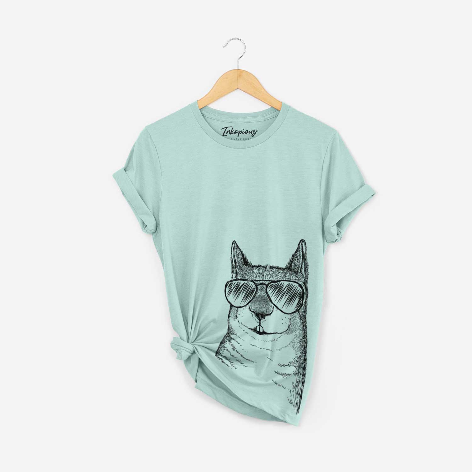 Hand-drawn sketch of Nibbles the Squirrel wearing aviator sunglasses on a Heather Sage Bella Canvas Unisex Crewneck