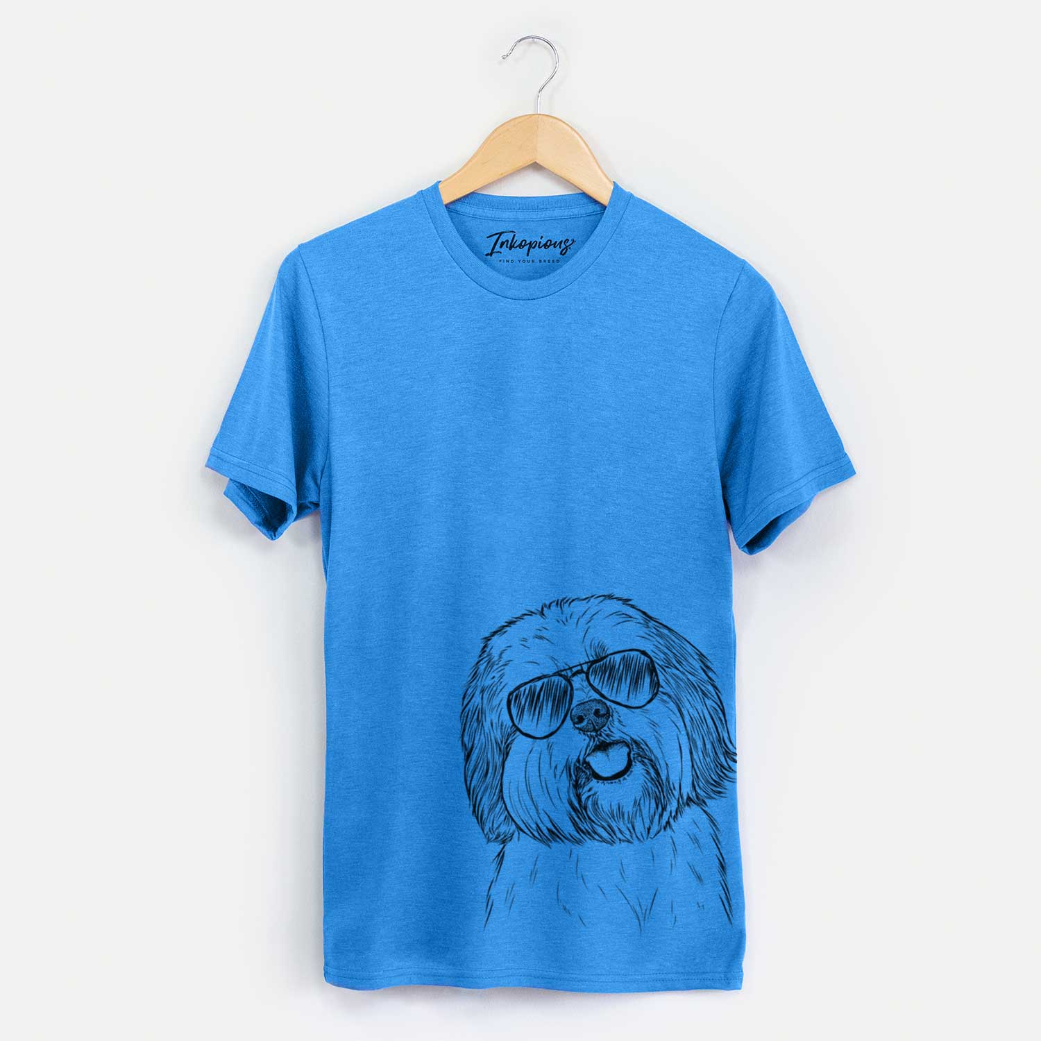 Hand-drawn sketch of Nikka the Lowchen wearing aviator sunglasses on a Blue Unisex crewneck