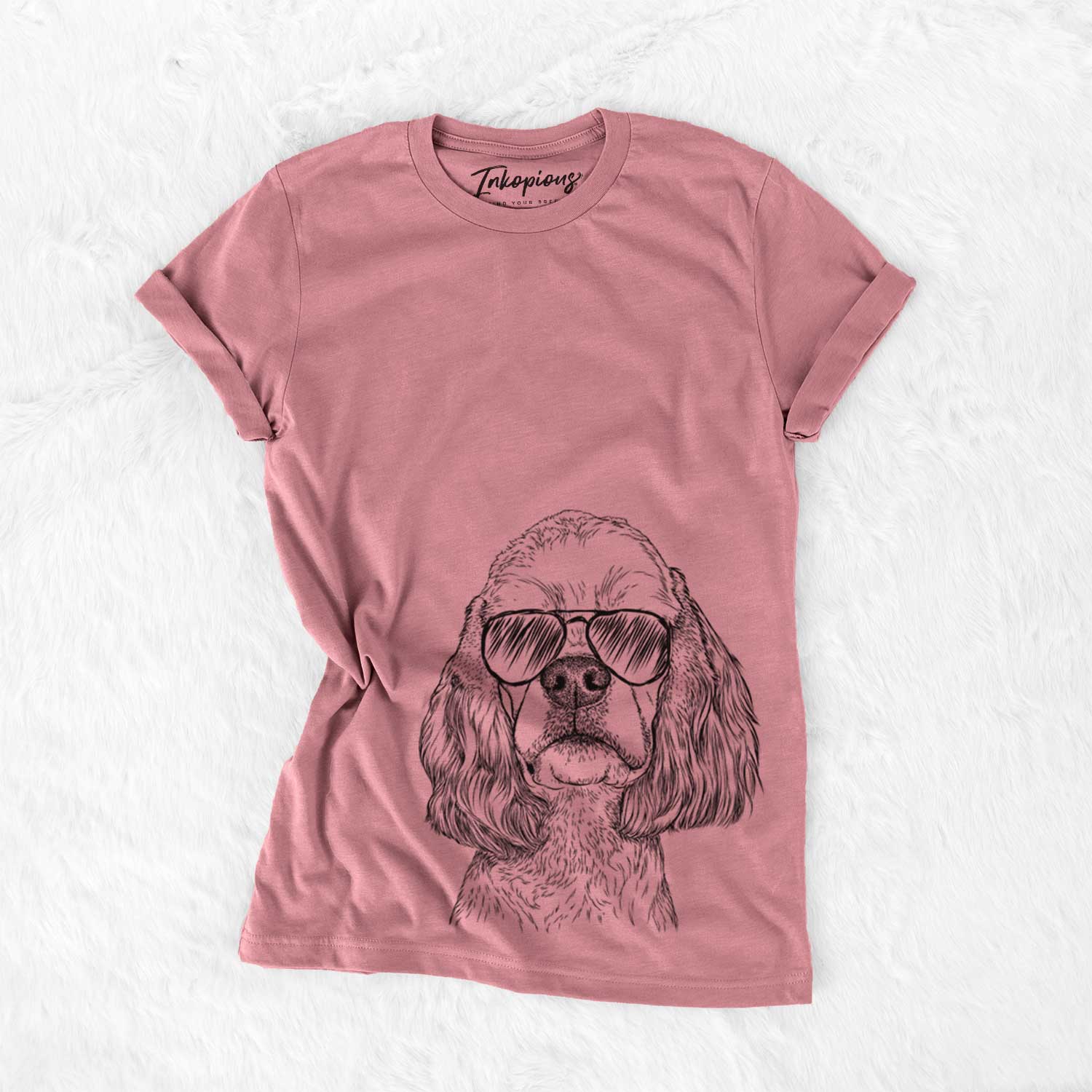 Hand-drawn sketch of Oakley the American Cocker Spaniel wearing aviator sunglasses on a Mauve Bella Canvas Unisex Crewneck