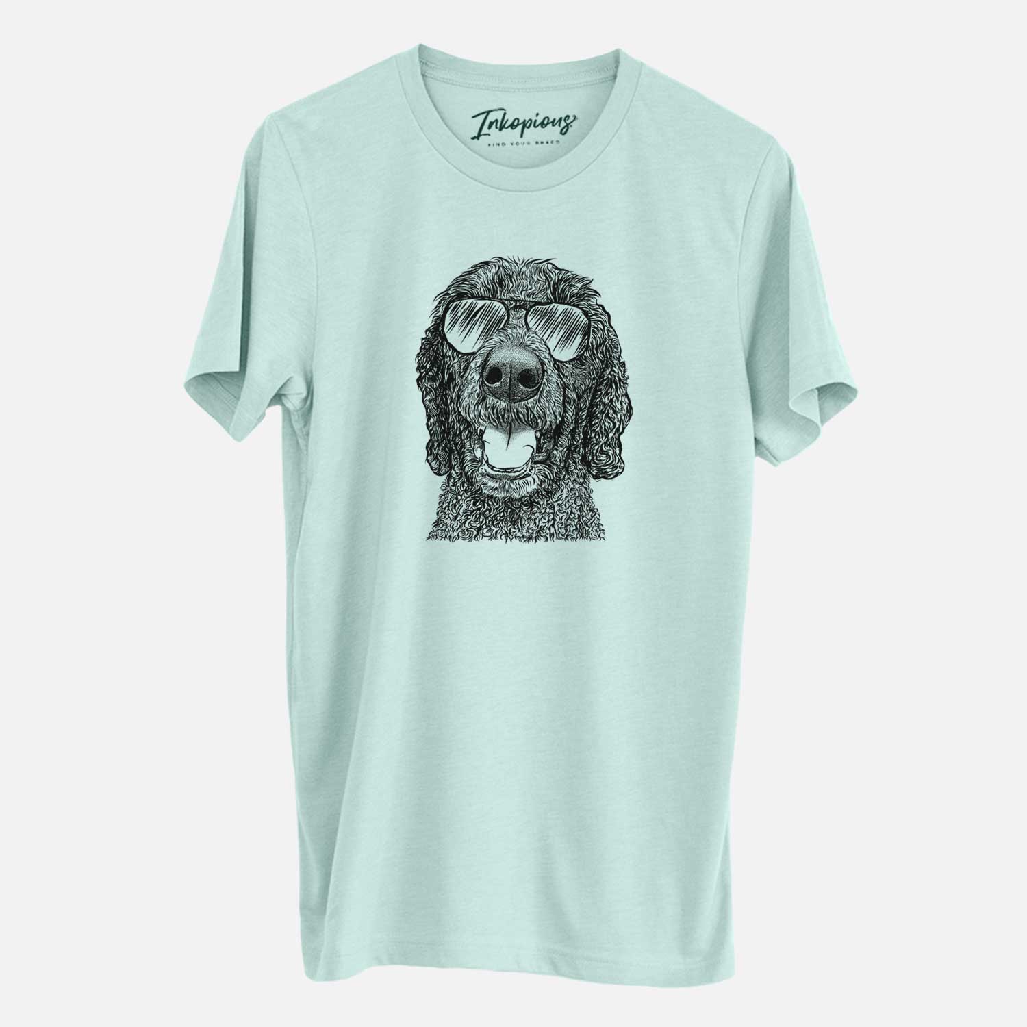 Hand-drawn sketch of Obi James the Goldendoodle wearing aviator sunglasses on a Heather Sage Unisex crewneck