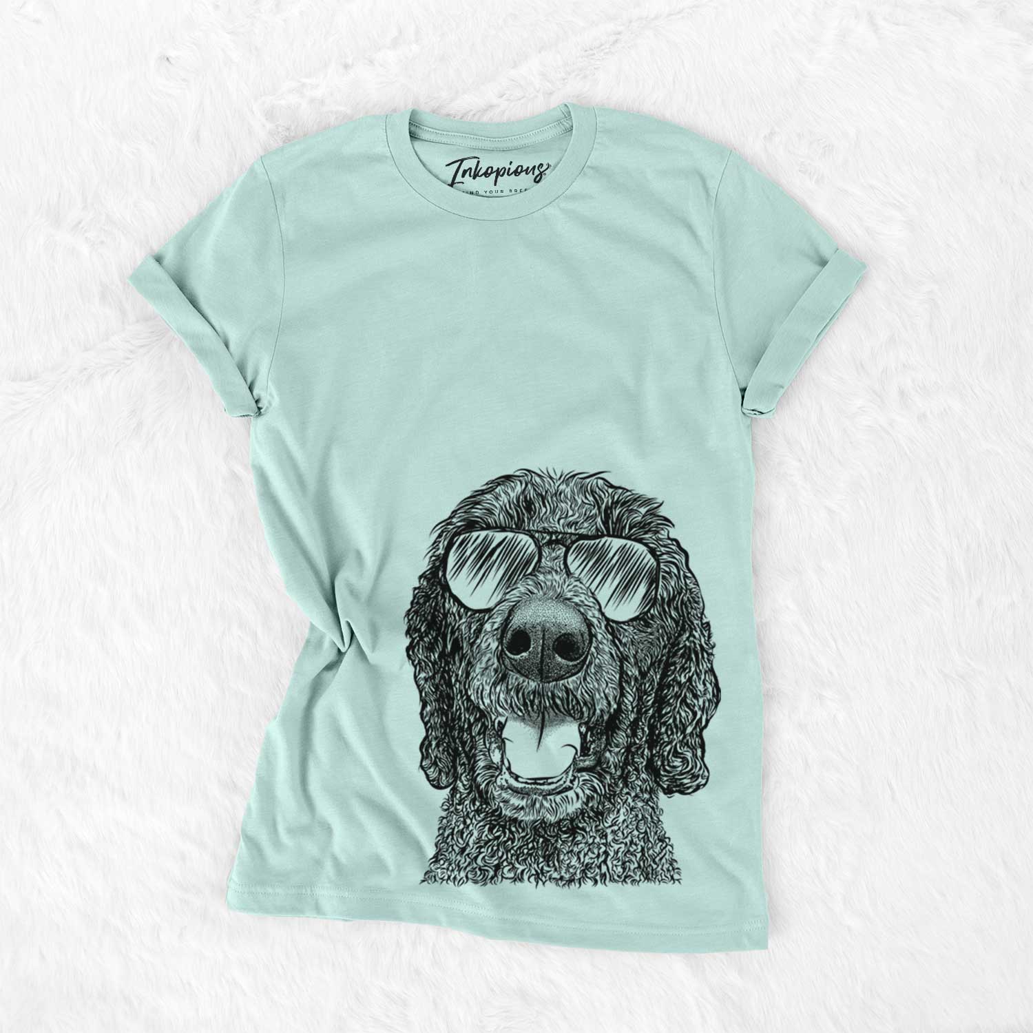 Hand-drawn sketch of Obi James the Goldendoodle wearing aviator sunglasses on a Heather Sage Unisex crewneck