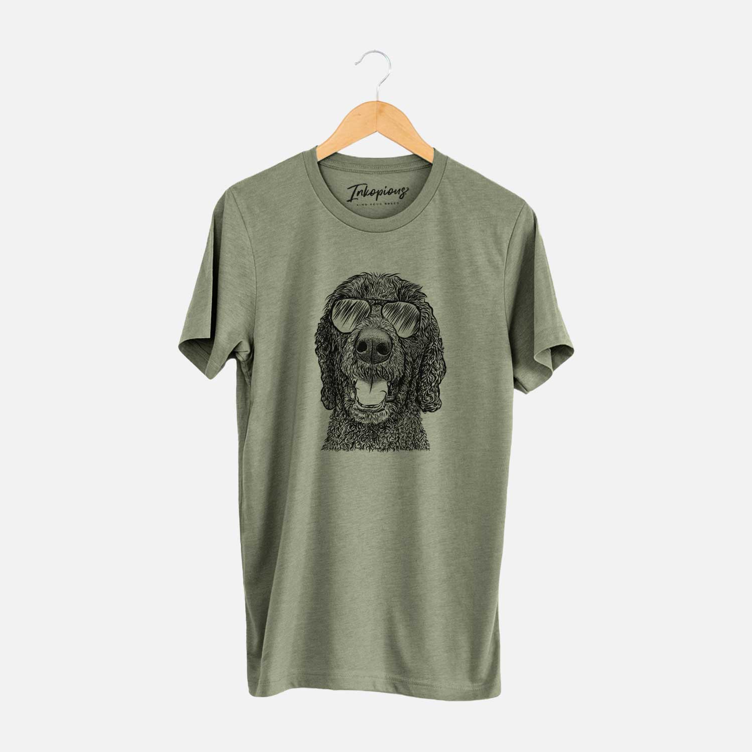 Hand-drawn sketch of Obi James the Goldendoodle wearing aviator sunglasses on an Olive Unisex crewneck