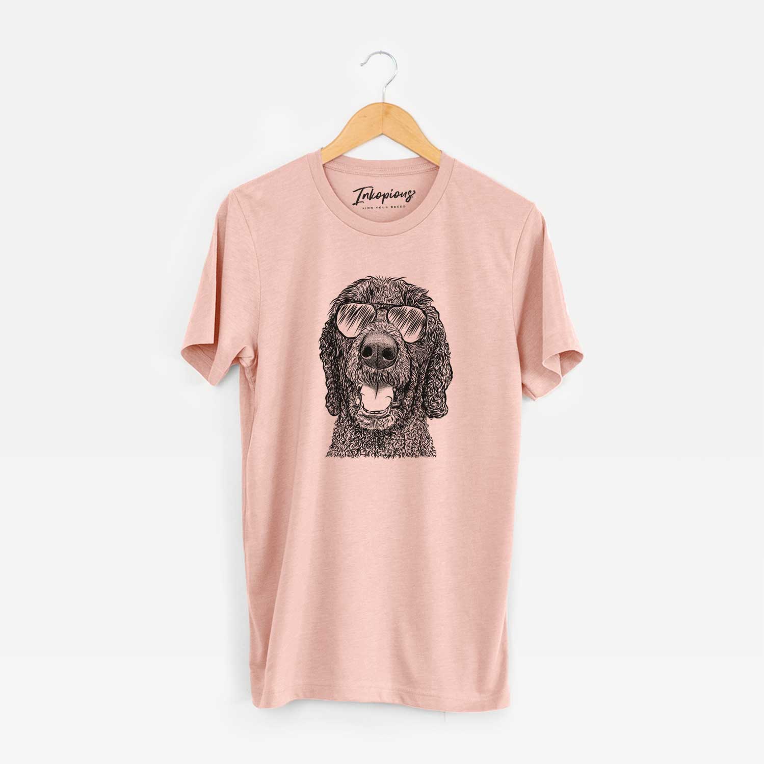 Hand-drawn sketch of Obi James the Goldendoodle wearing aviator sunglasses on a Peach Unisex crewneck