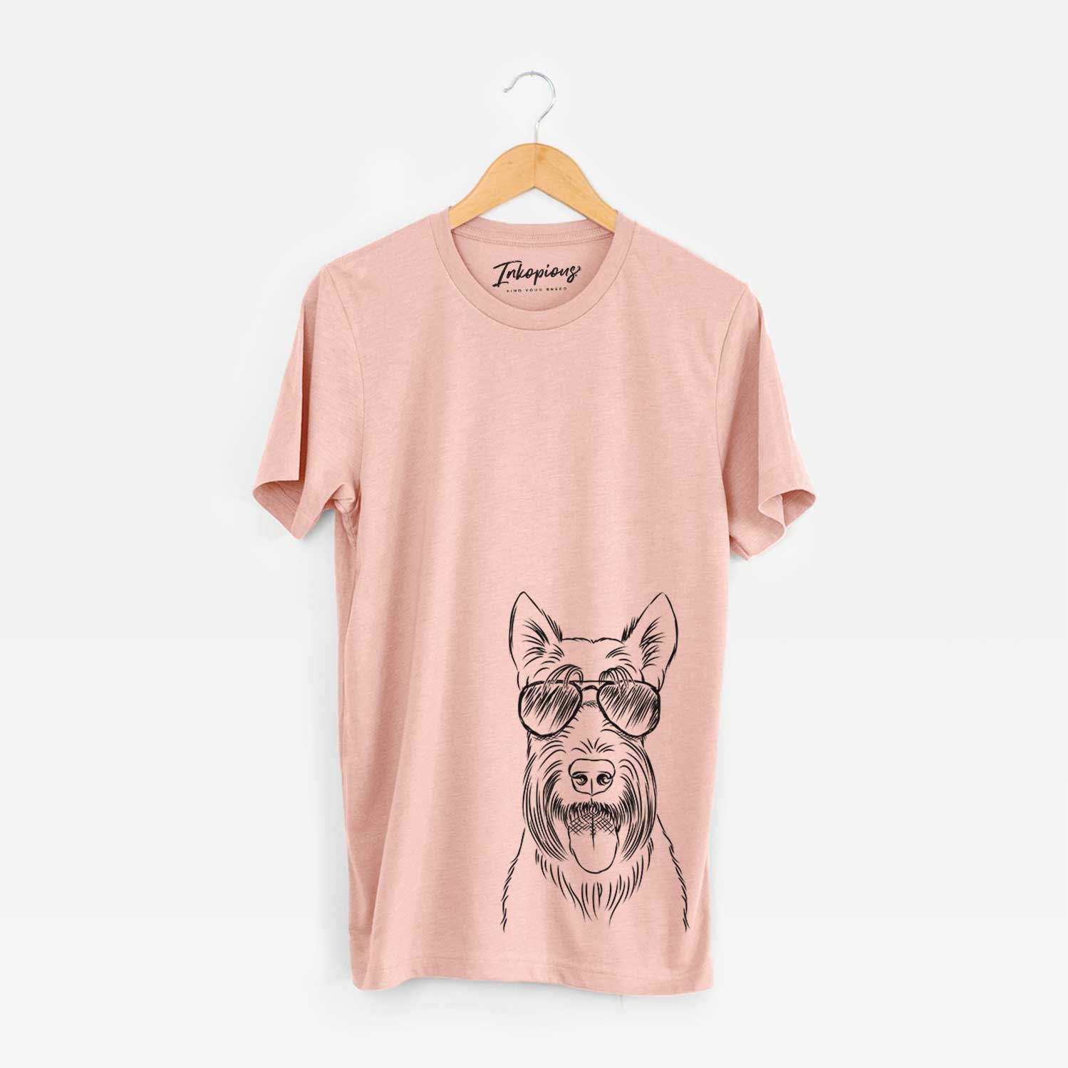 Hand-drawn sketch of Oswald the Scottish Terrier wearing aviator sunglasses on a Peach Bella Canvas Unisex Crewneck
