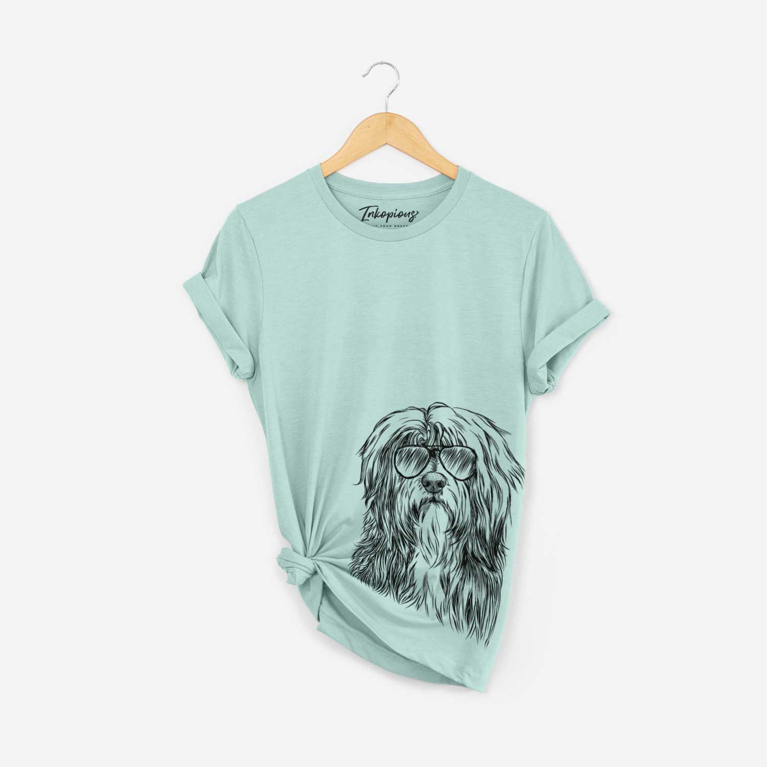 Hand-drawn sketch of Otto the Polish Lowland Sheepdog wearing aviator sunglasses on a Heather Sage Bella Canvas Unisex Crewneck