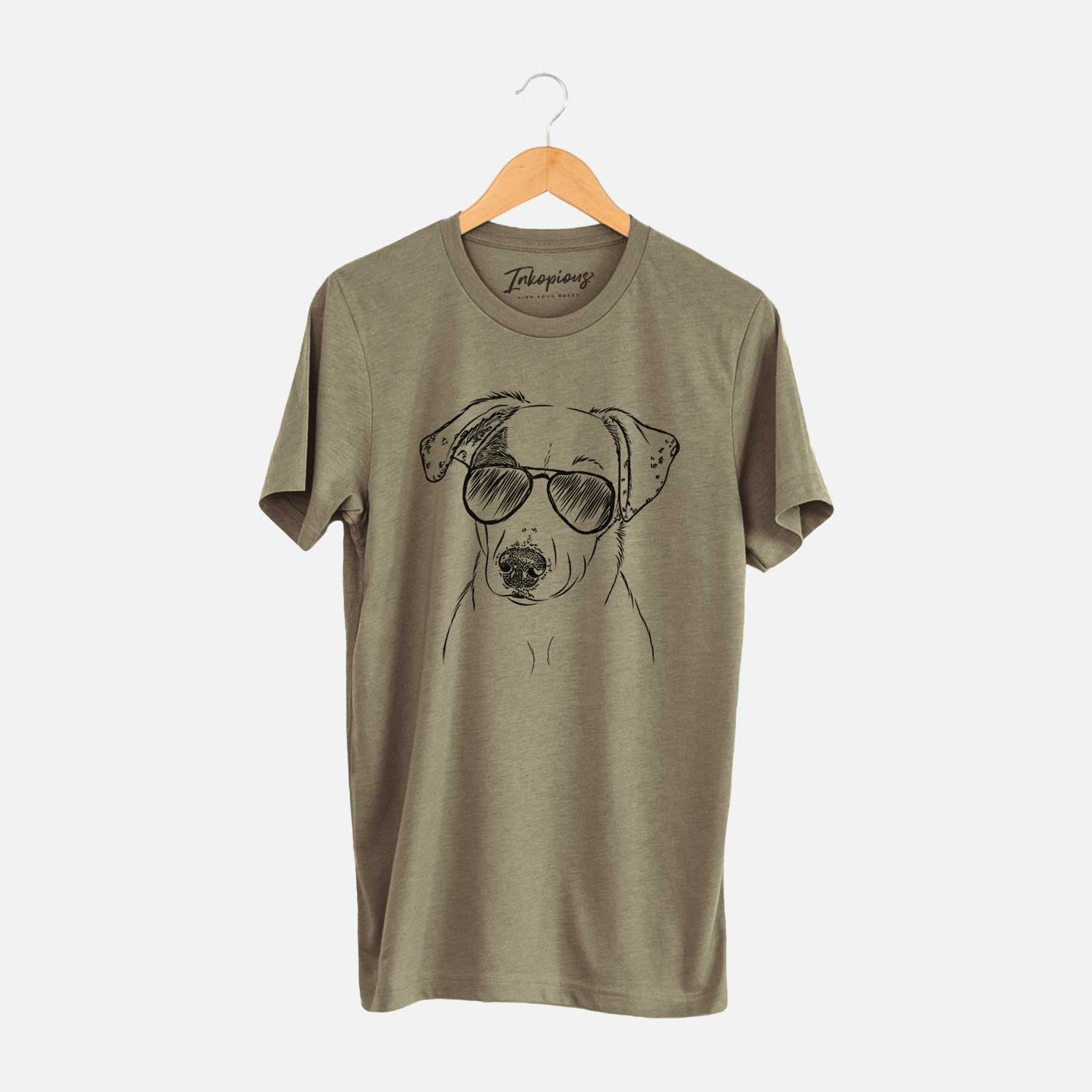 Hand-drawn sketch of P-Pie the Mixed Breed wearing aviator sunglasses on an Olive Unisex crewneck
