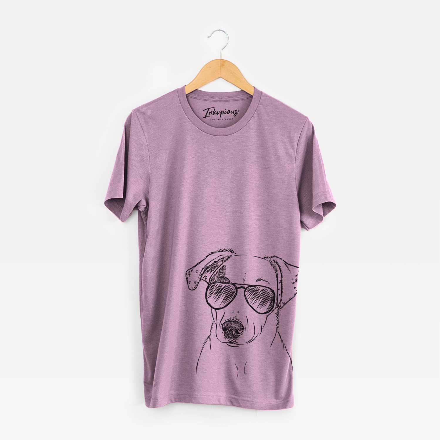 Hand-drawn sketch of P-Pie the Mixed Breed wearing aviator sunglasses on an Orchid Unisex crewneck