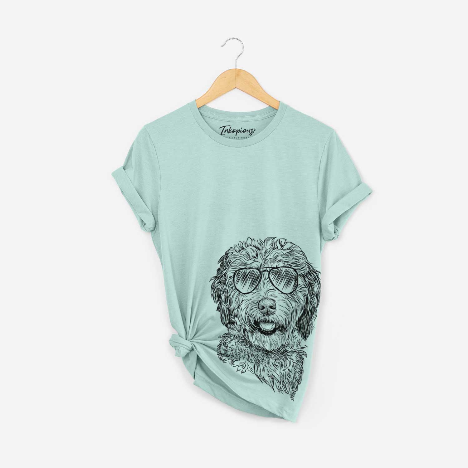 Hand-drawn sketch of Palmer the Aussiedoodle wearing aviator sunglasses on a Heather Sage Bella Canvas Unisex Crewneck