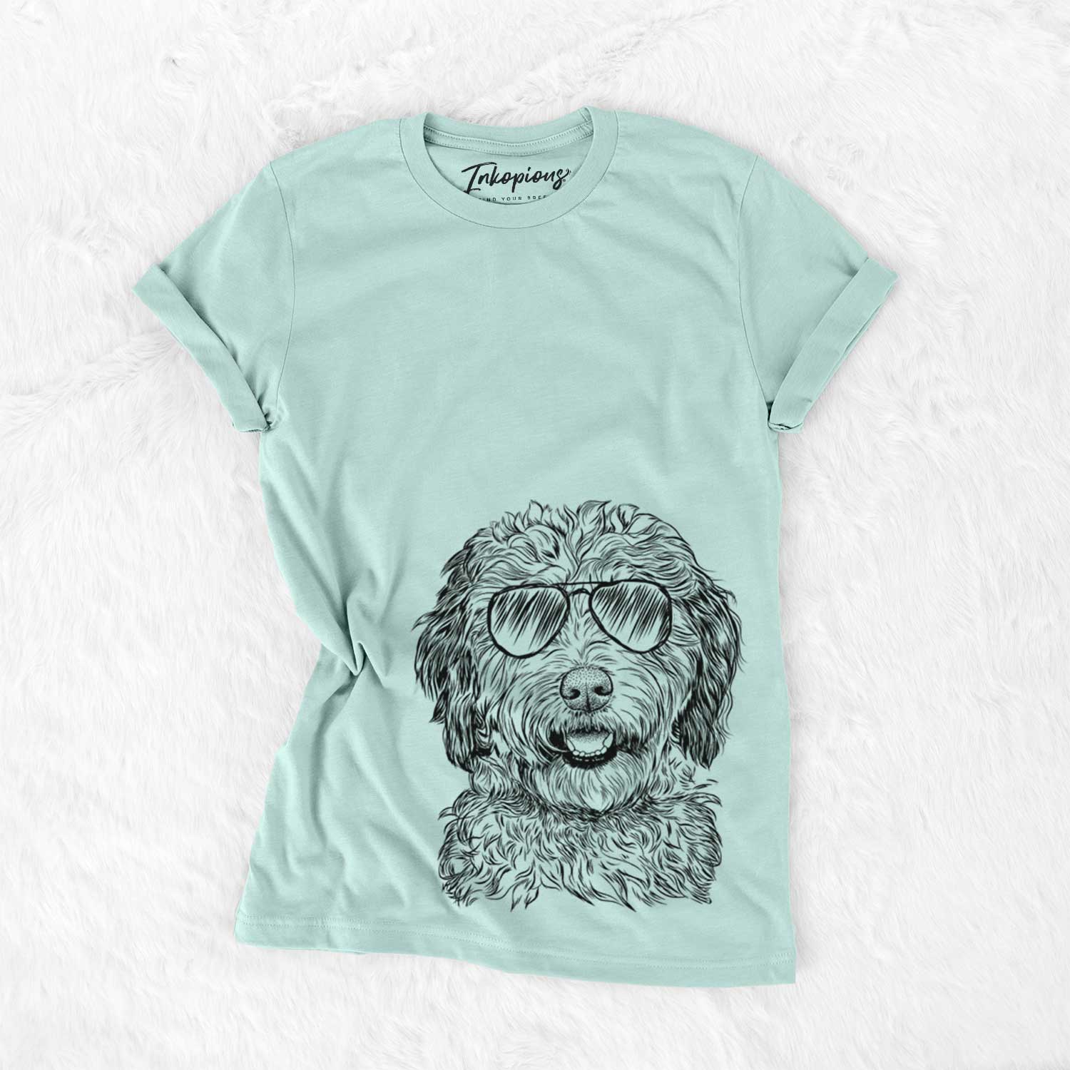 Hand-drawn sketch of Palmer the Aussiedoodle wearing aviator sunglasses on a Heather Sage Unisex crewneck