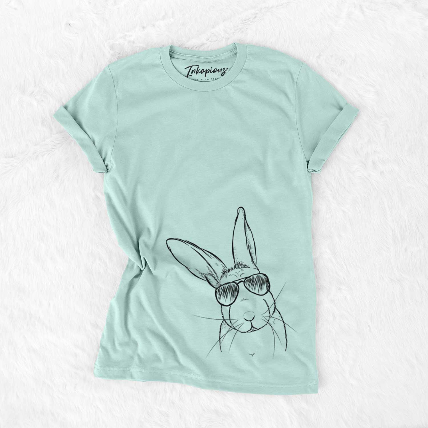 Hand-drawn sketch of Penny the Belgian Hare wearing aviator sunglasses on a Heather Sage Unisex crewneck