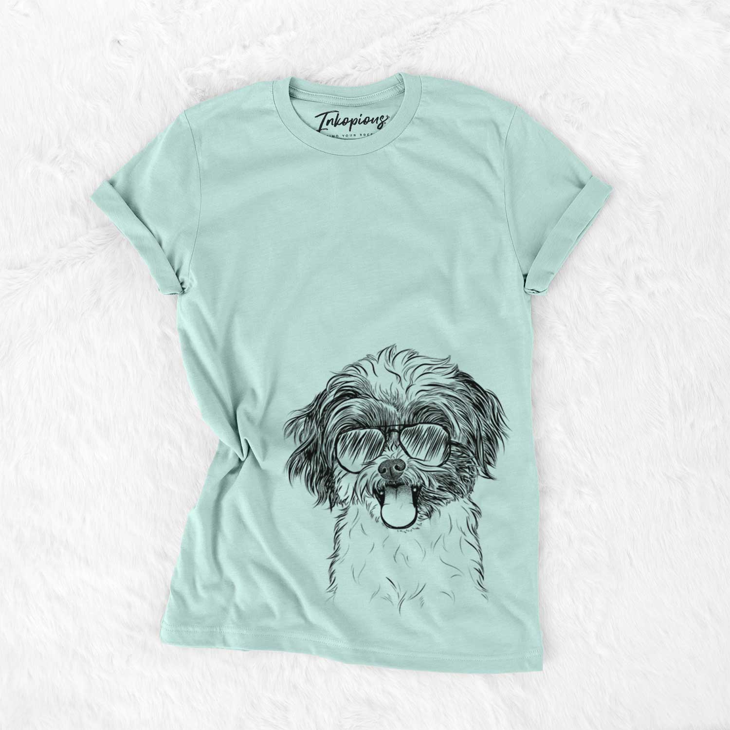 Hand-drawn sketch of Pepper the Shihpoo wearing aviator sunglasses on a Heather Sage Unisex crewneck