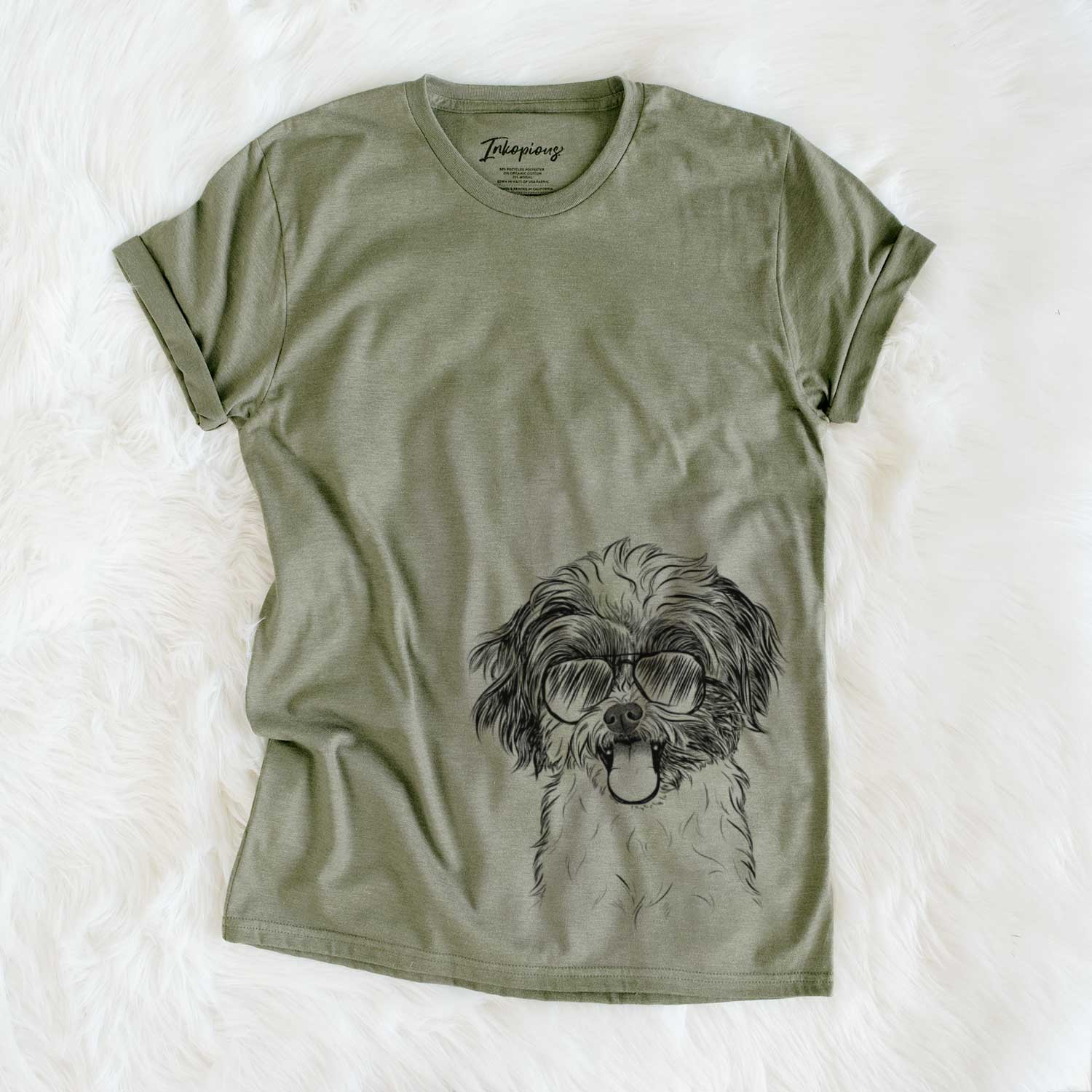 Hand-drawn sketch of Pepper the Shihpoo wearing aviator sunglasses on an Olive Unisex crewneck