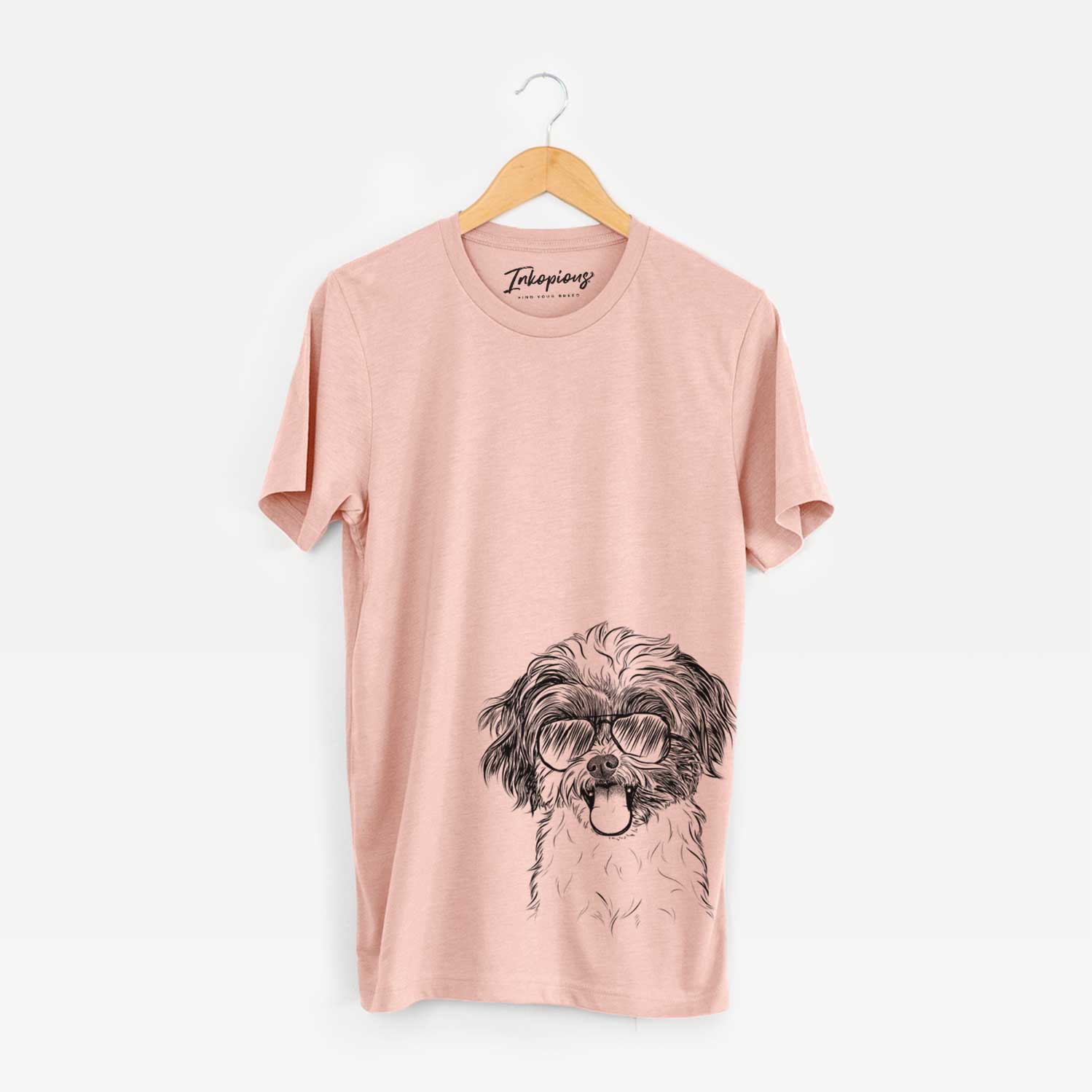 Hand-drawn sketch of Pepper the Shihpoo wearing aviator sunglasses on a Peach Bella Canvas Unisex Crewneck