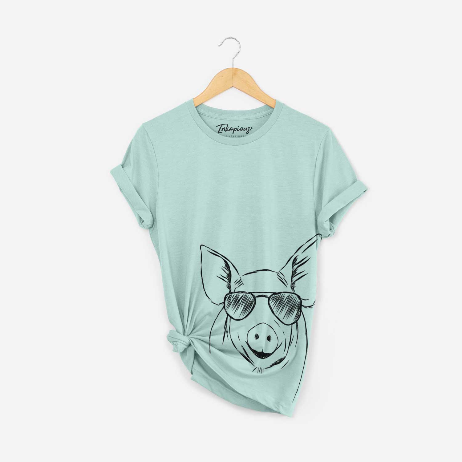 Hand-drawn sketch of Perry the Pig wearing aviator sunglasses on a Heather Sage Bella Canvas Unisex Crewneck