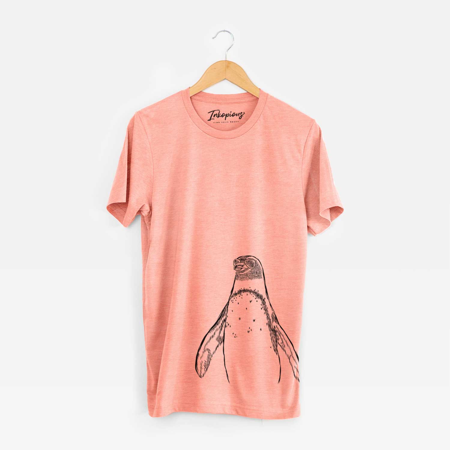 Hand-drawn sketch of Peyton the Penguin wearing aviator sunglasses on a Sunset Unisex crewneck