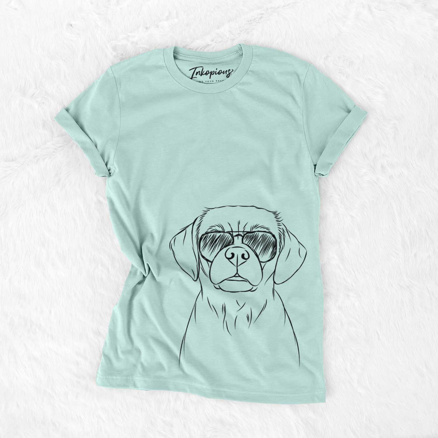 Hand-drawn sketch of Popcorn the Puggle wearing aviator sunglasses on a Heather Sage Unisex crewneck