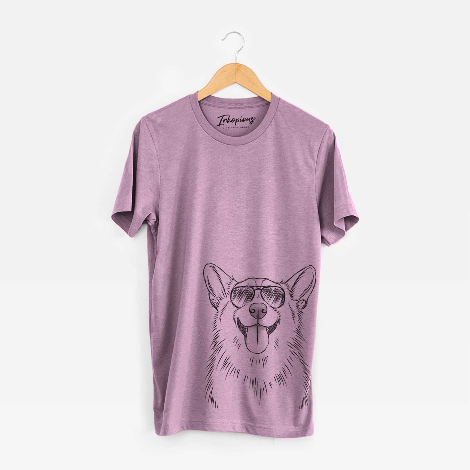 Hand-drawn sketch of Porter the Pembroke Welsh Corgi wearing aviator sunglasses on an Orchid Unisex crewneck