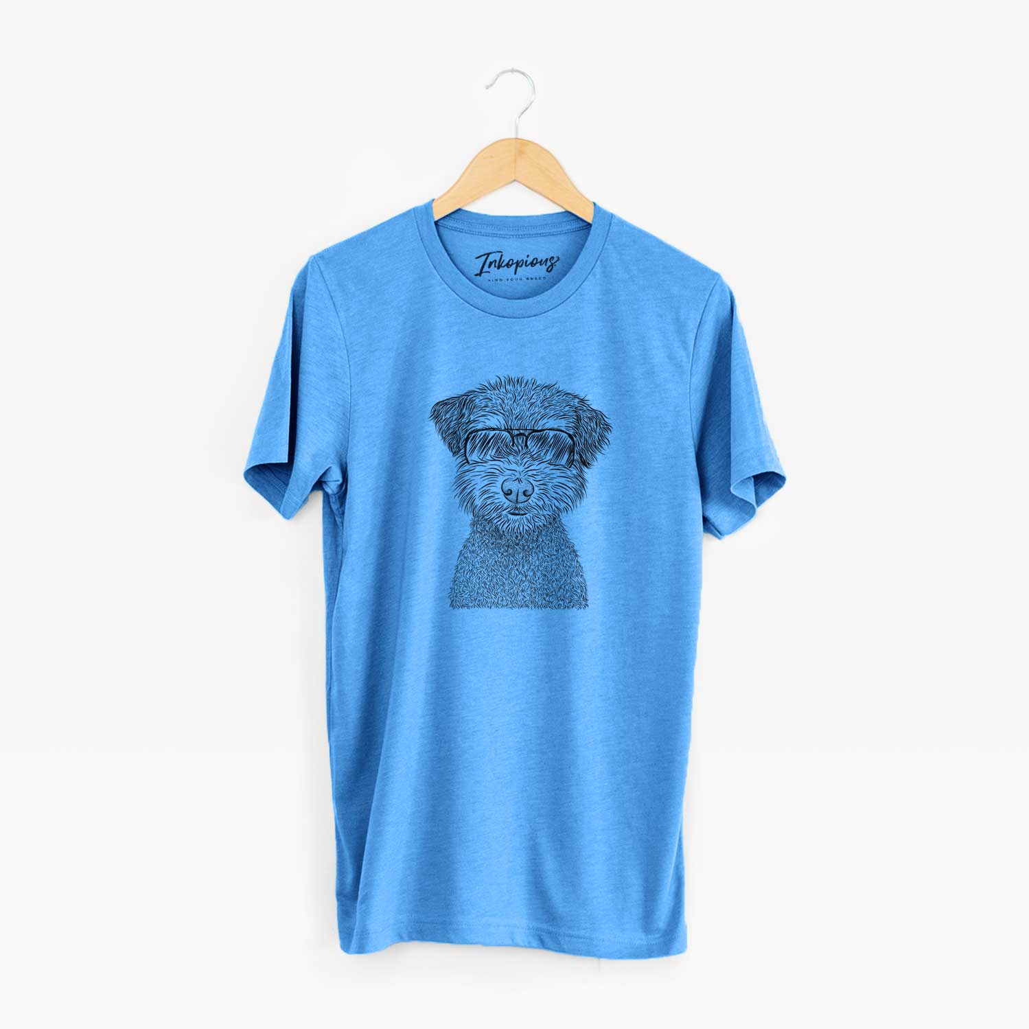 Hand-drawn sketch of Pretzel the Schnoodle wearing aviator sunglasses on a Blue Unisex crewneck