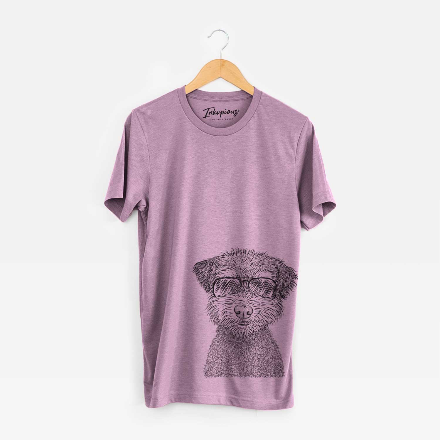 Hand-drawn sketch of Pretzel the Schnoodle wearing aviator sunglasses on an Orchid Unisex crewneck