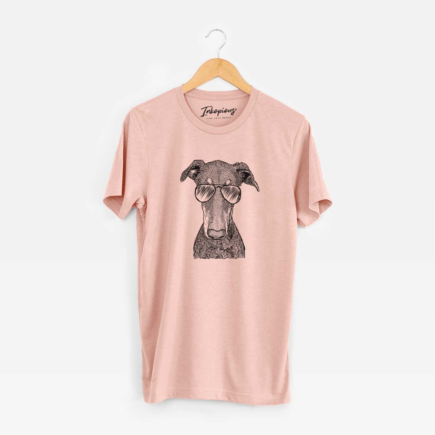 Hand-drawn sketch of Princess Fiona the Doberman Pinscher wearing aviator sunglasses on a Peach Unisex crewneck