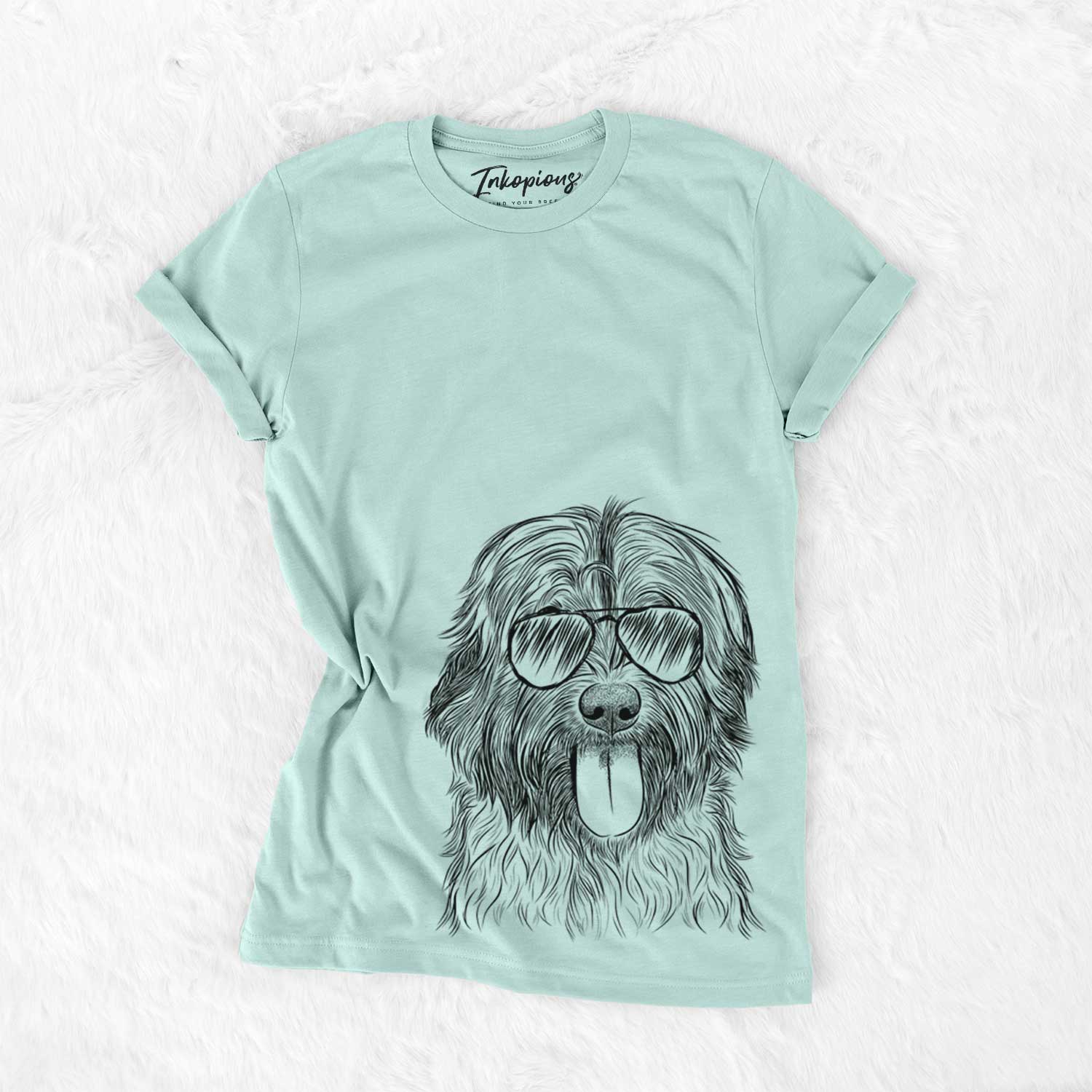 Hand-drawn sketch of Puig the Catalan Sheepdog wearing aviator sunglasses on a Heather Sage Unisex crewneck