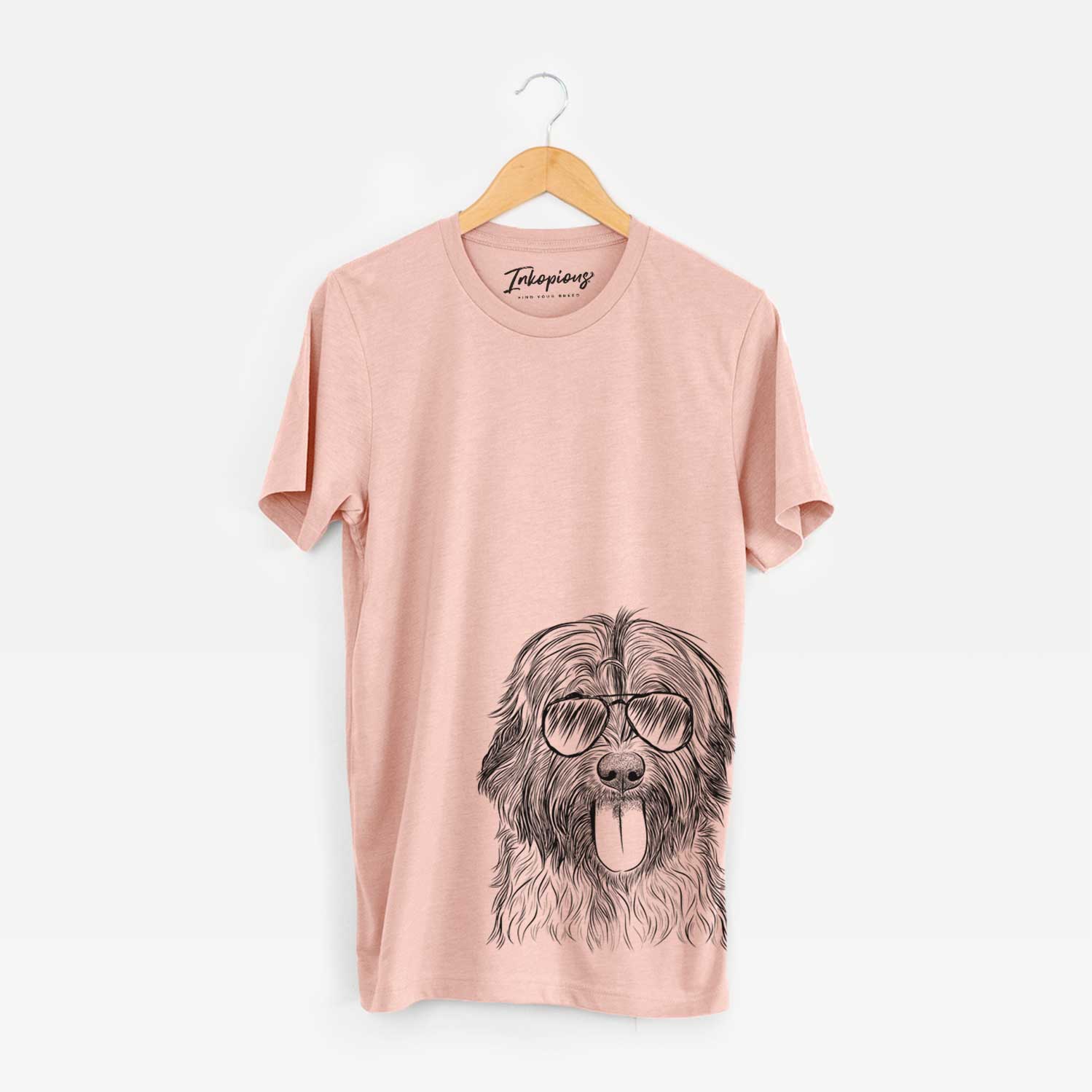 Hand-drawn sketch of Puig the Catalan Sheepdog wearing aviator sunglasses on a Peach Bella Canvas Unisex Crewneck