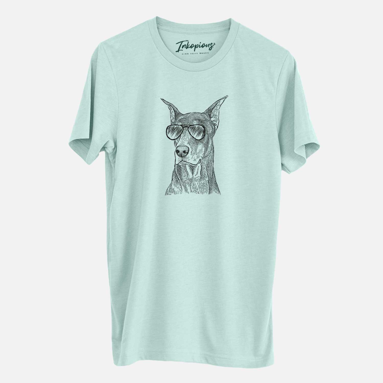 Hand-drawn sketch of RJ the Doberman Pinscher wearing aviator sunglasses on a Heather Sage Unisex crewneck