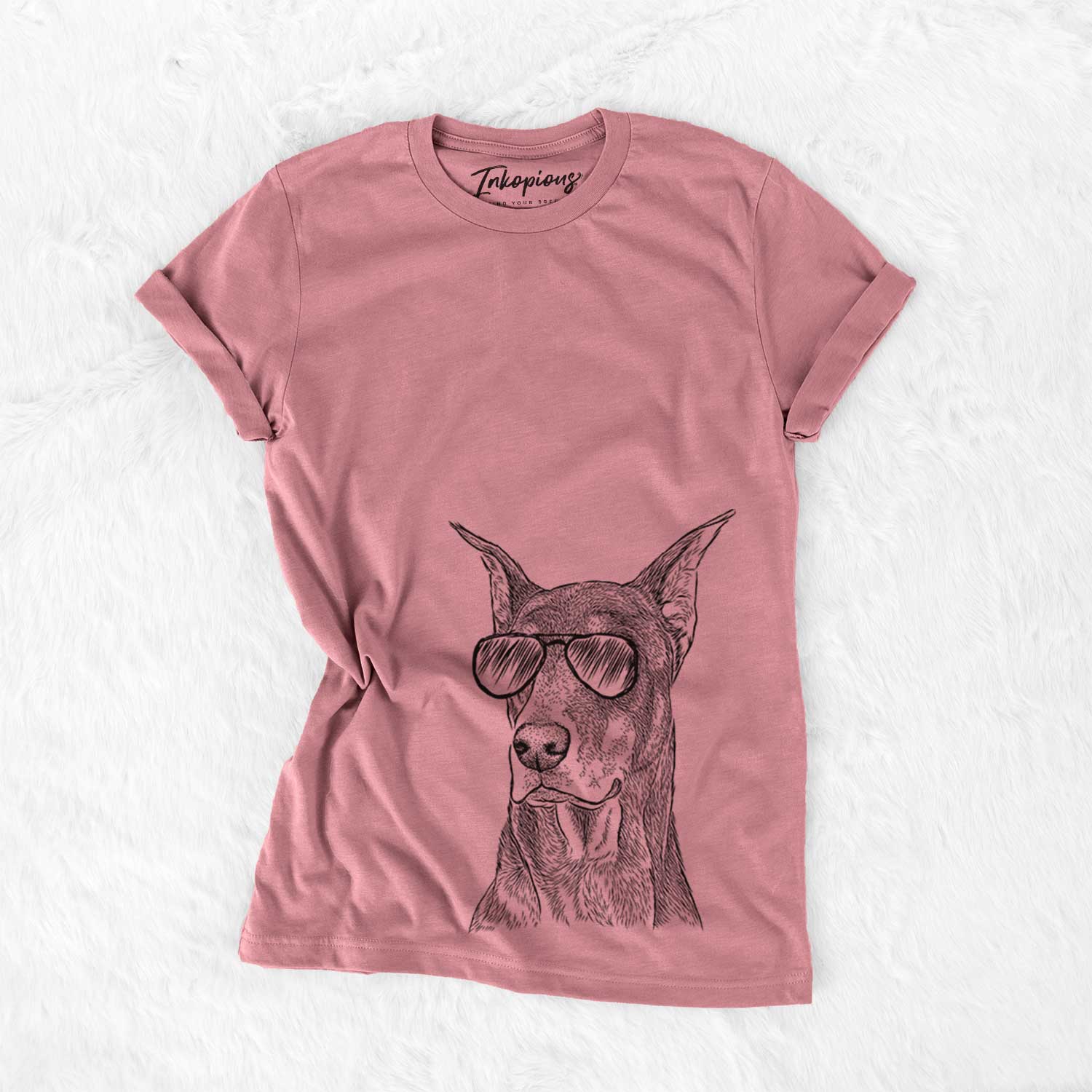 Hand-drawn sketch of RJ the Doberman Pinscher wearing aviator sunglasses on a Mauve Unisex crewneck
