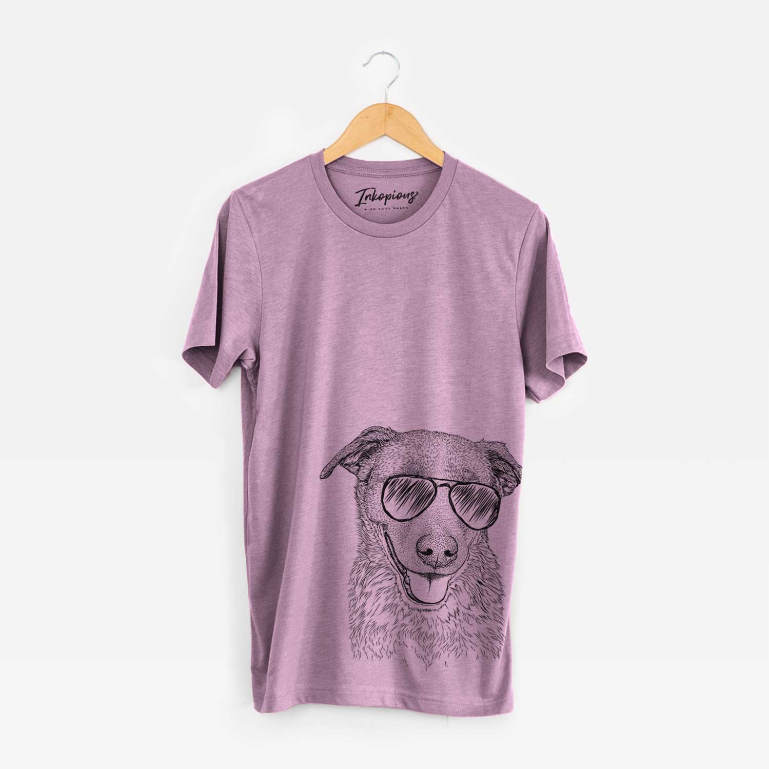 Hand-drawn sketch of Reef the Mixed Breed wearing aviator sunglasses on an Orchid Bella Canvas Unisex Crewneck