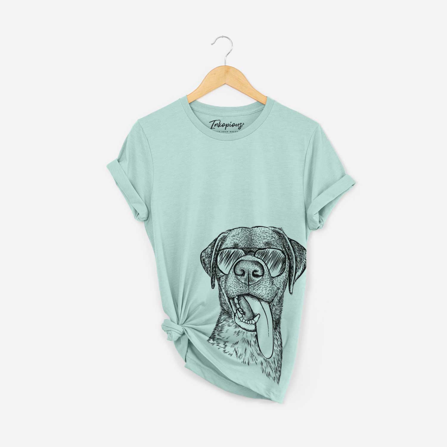 Hand-drawn sketch of Reese the Mixed Breed wearing aviator sunglasses on a Heather Sage Bella Canvas Unisex Crewneck
