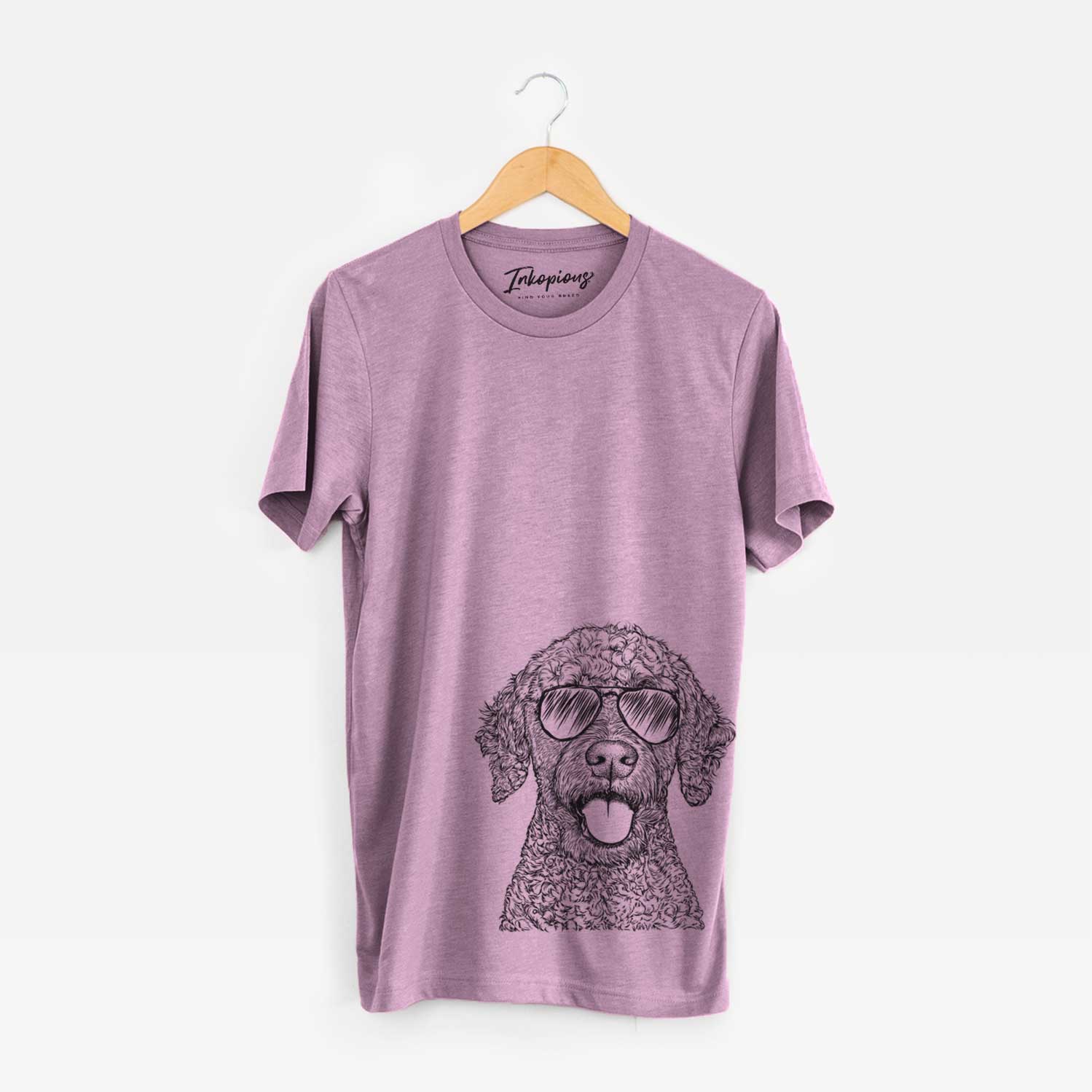Hand-drawn sketch of Reina the Spanish Water Dog wearing aviator sunglasses on an Orchid Unisex crewneck