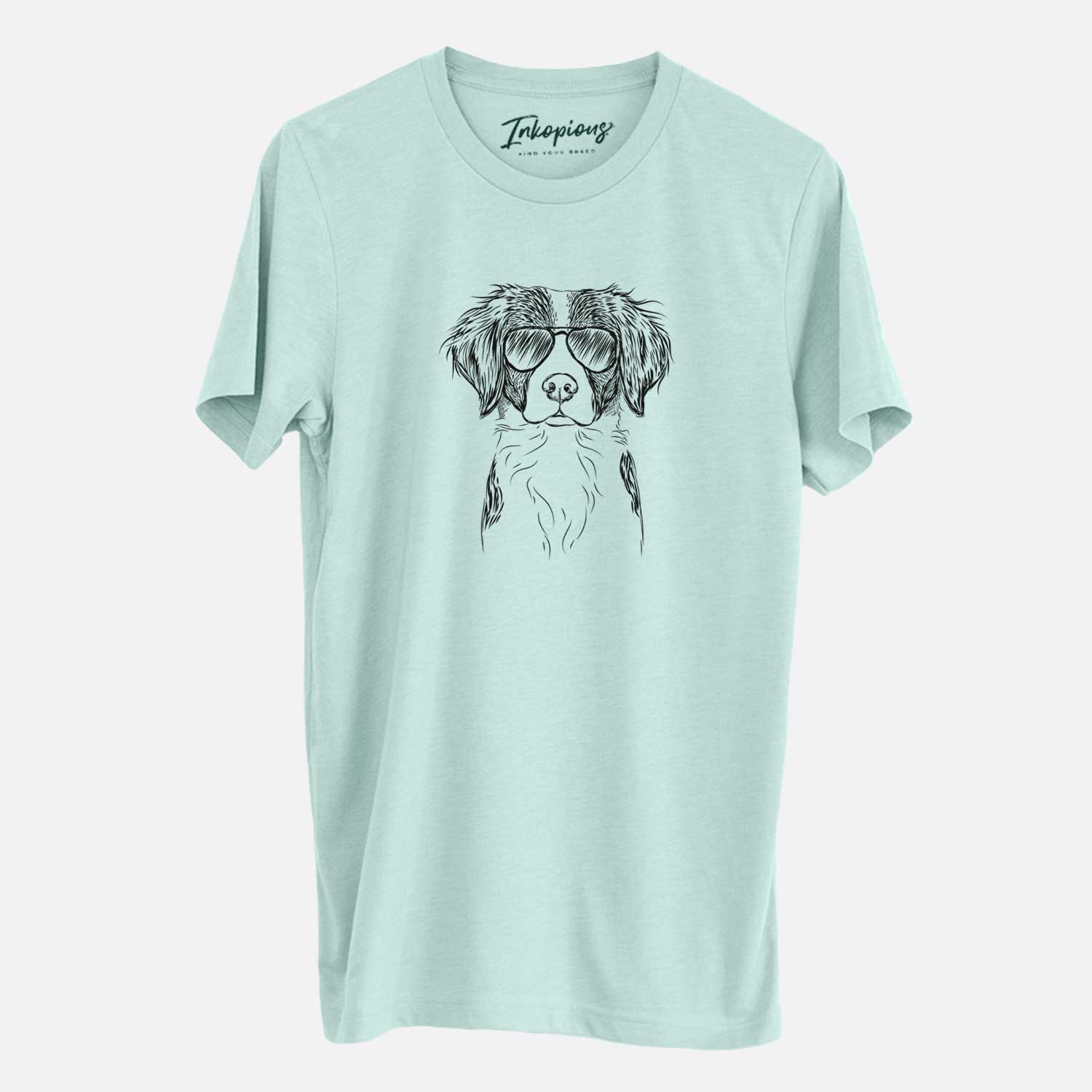 Hand-drawn sketch of Remi the Brittany wearing aviator sunglasses on a Heather Sage Unisex crewneck