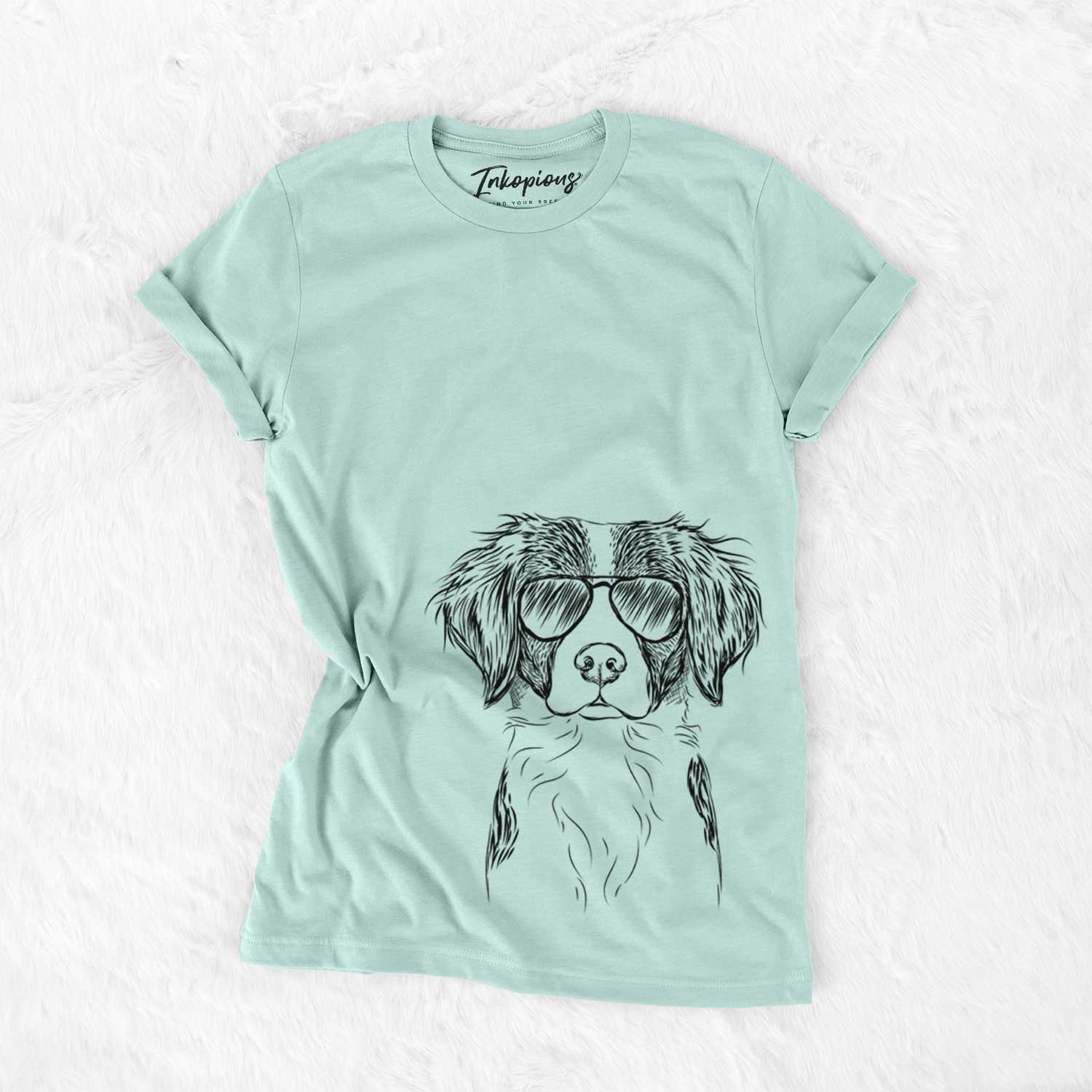 Hand-drawn sketch of Remi the Brittany wearing aviator sunglasses on a Heather Sage Unisex crewneck