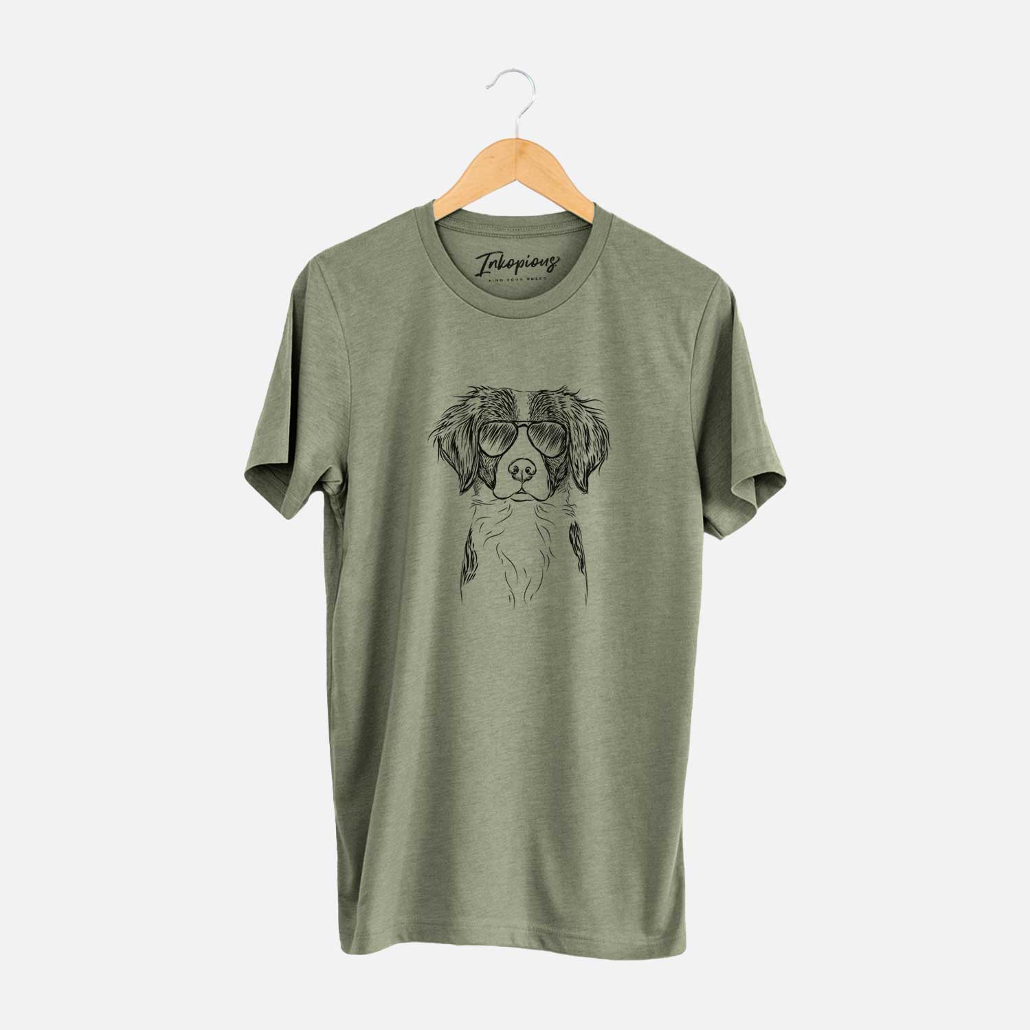 Hand-drawn sketch of Remi the Brittany wearing aviator sunglasses on an Olive Unisex crewneck
