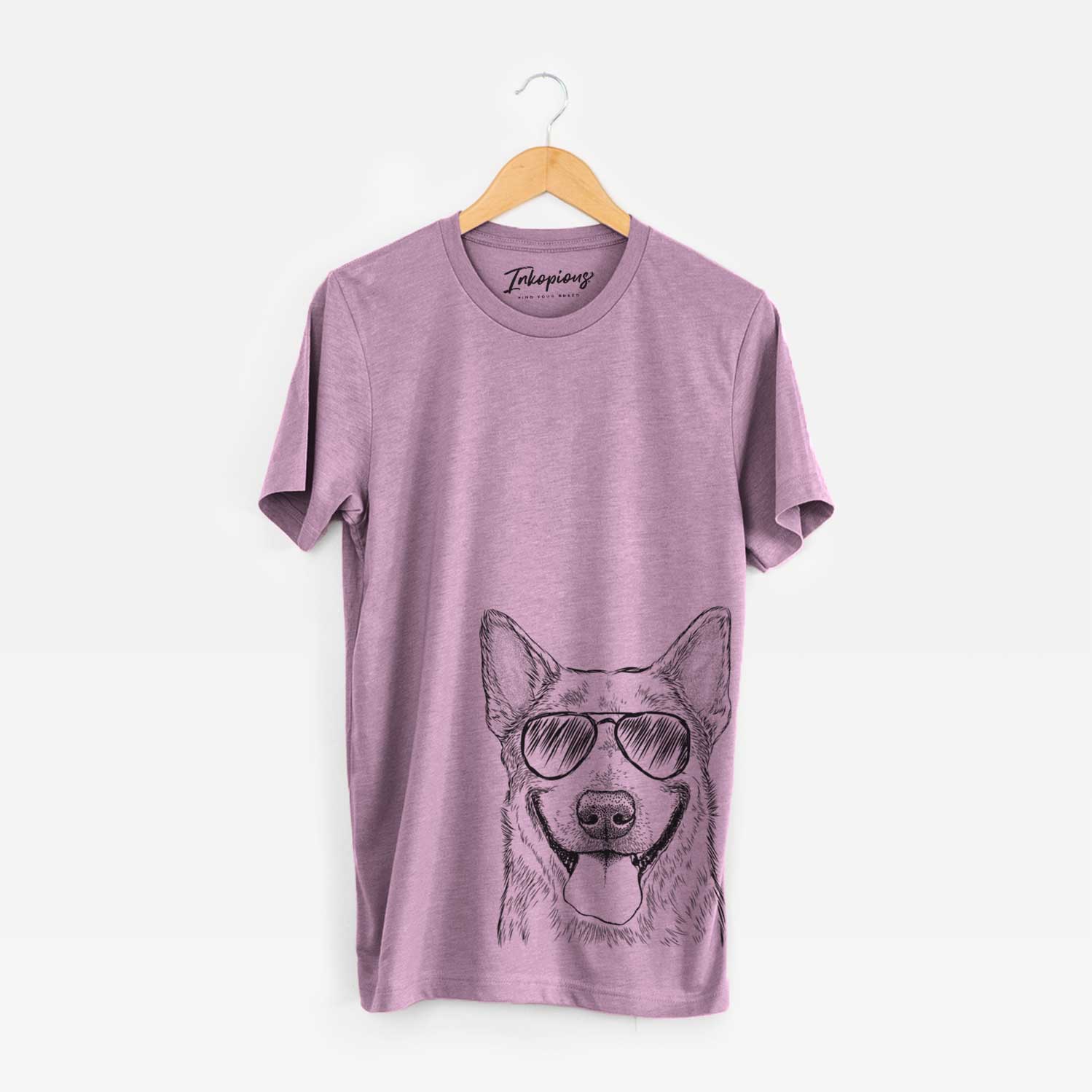 Hand-drawn sketch of Rio the Australian Cattle Dog wearing aviator sunglasses on an Orchid Unisex crewneck