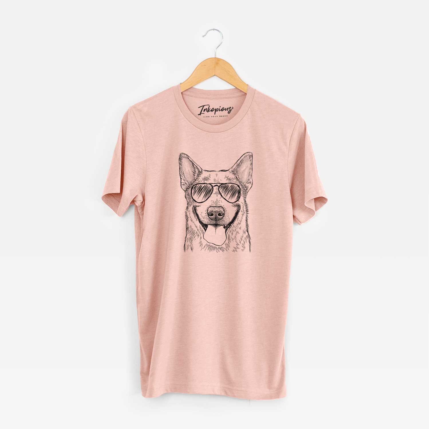 Hand-drawn sketch of Rio the Australian Cattle Dog wearing aviator sunglasses on a Peach Unisex crewneck
