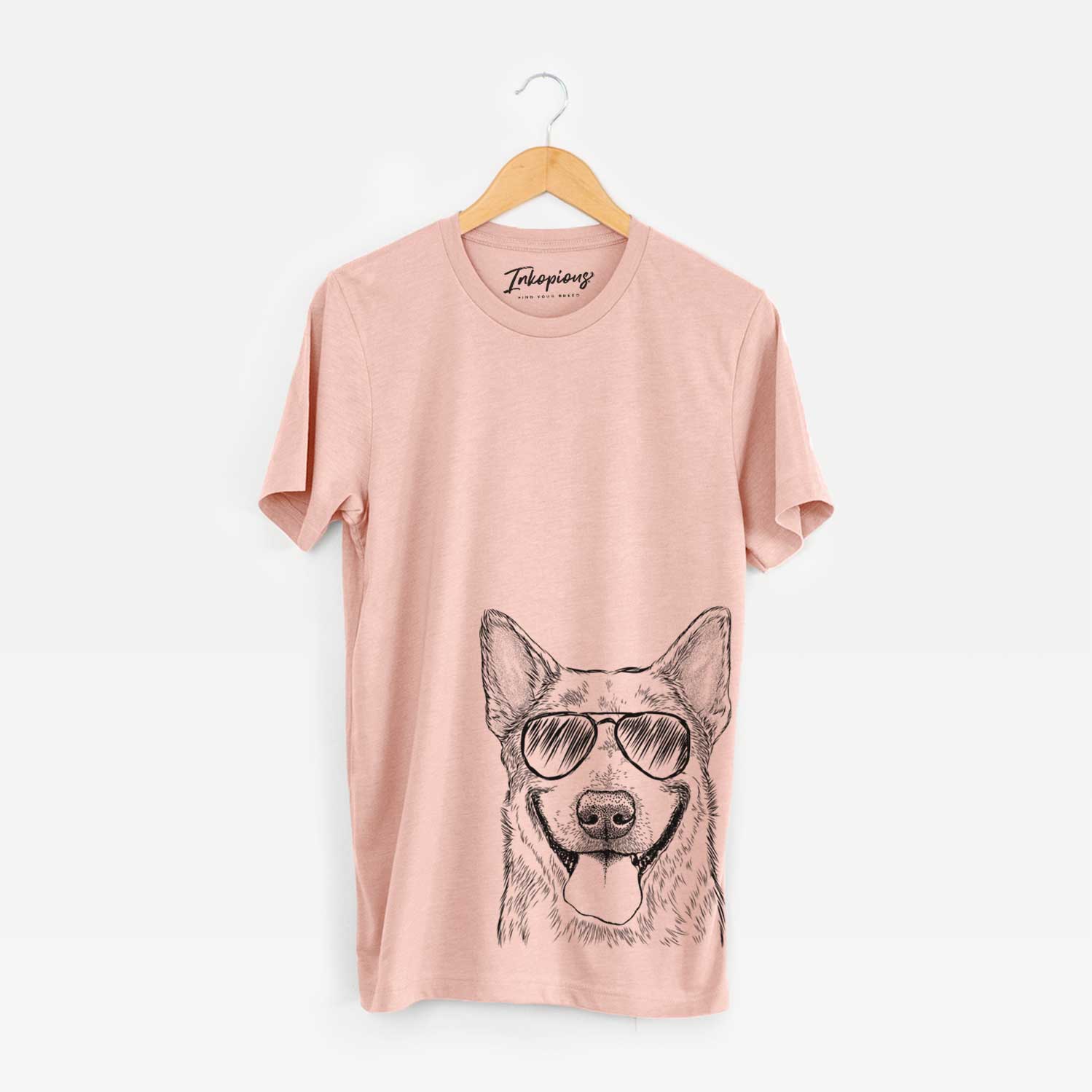 Hand-drawn sketch of Rio the Australian Cattle Dog wearing aviator sunglasses on a Peach Unisex crewneck