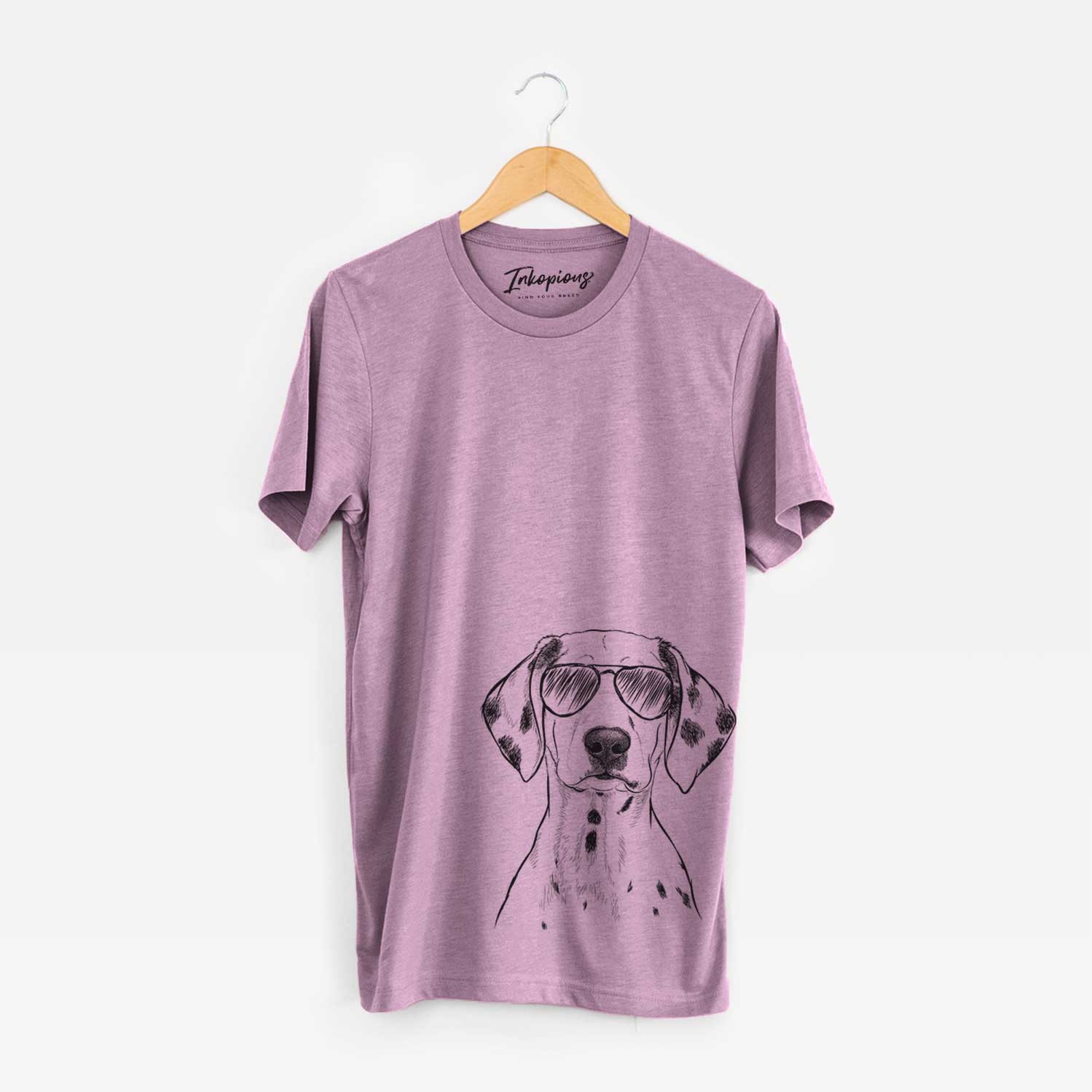 Hand-drawn sketch of Riot the Dalmatian wearing aviator sunglasses on an Orchid Unisex crewneck