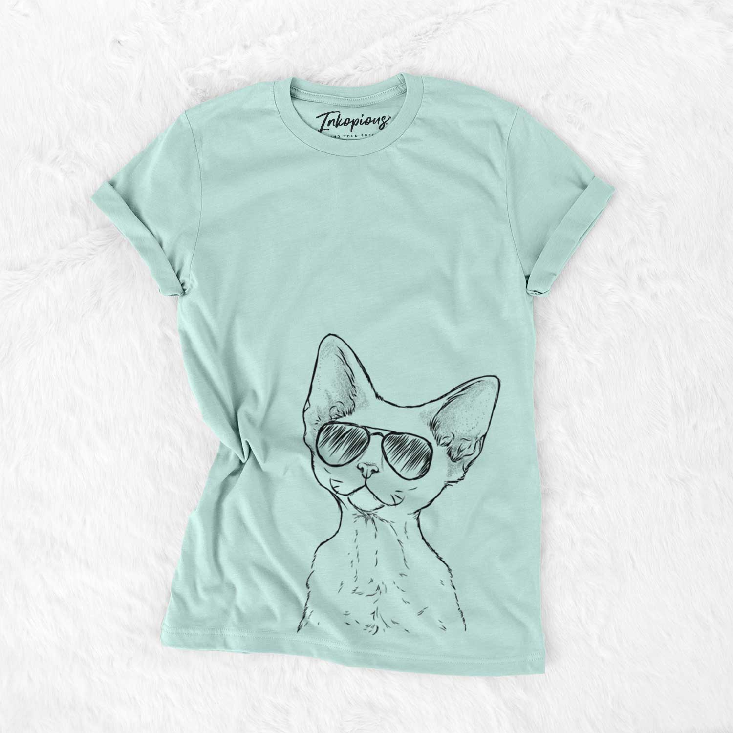 Hand-drawn sketch of Ripley the Devon Rex Cat wearing aviator sunglasses on a Heather Sage Unisex crewneck