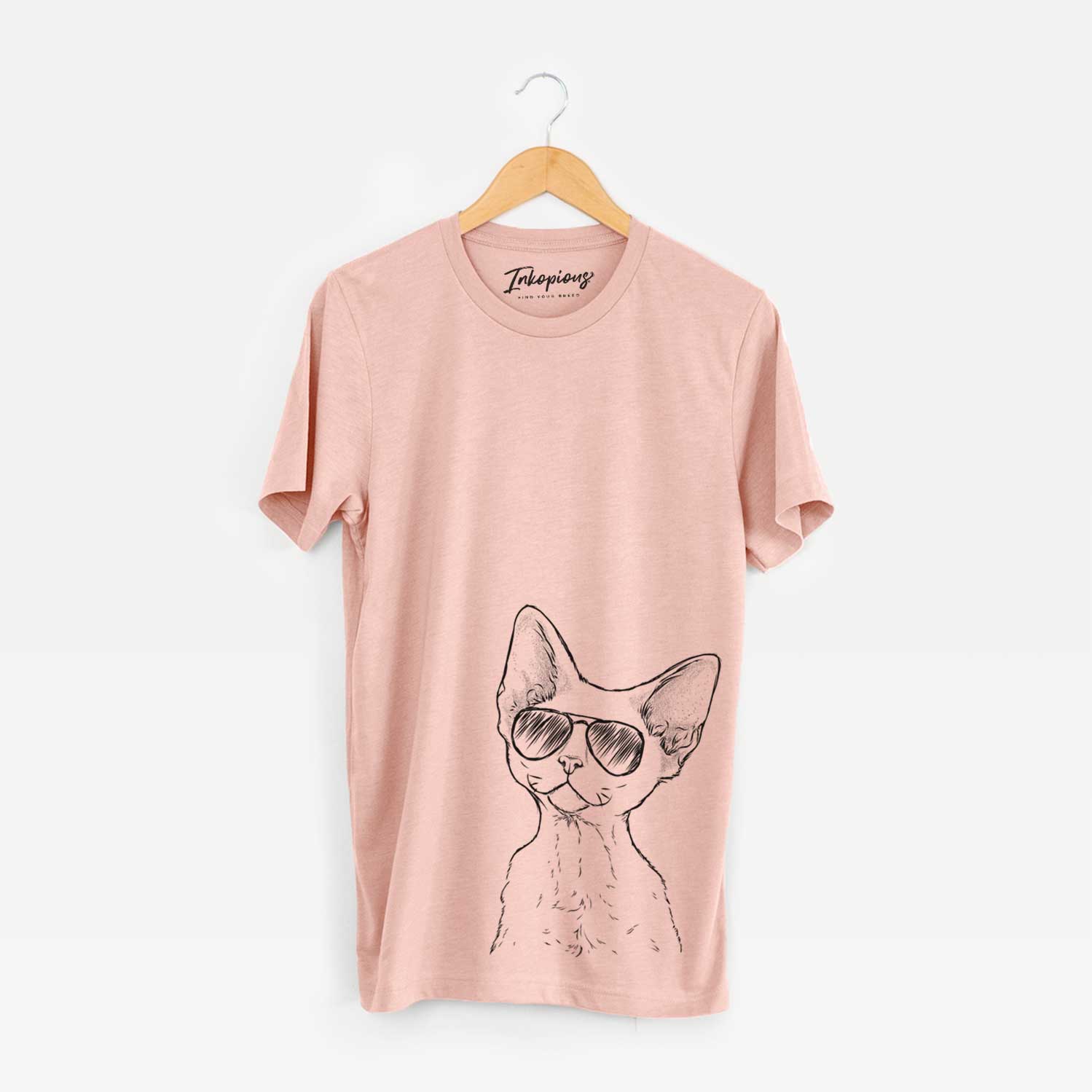 Hand-drawn sketch of Ripley the Devon Rex Cat wearing aviator sunglasses on a Peach Unisex crewneck